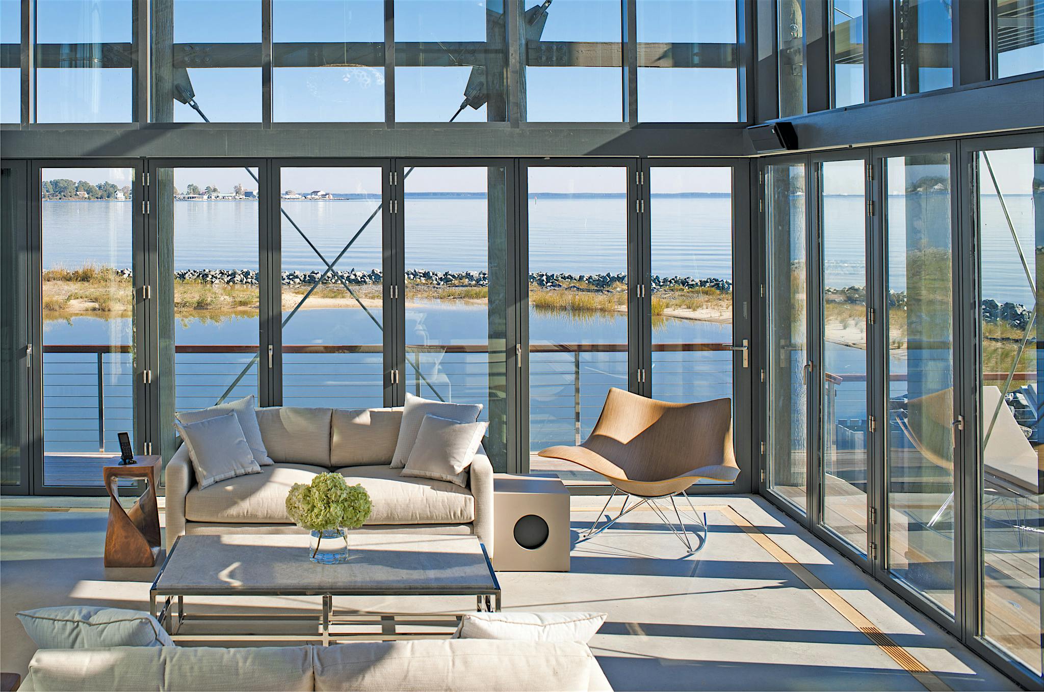 folding glass walls systems in beach house design