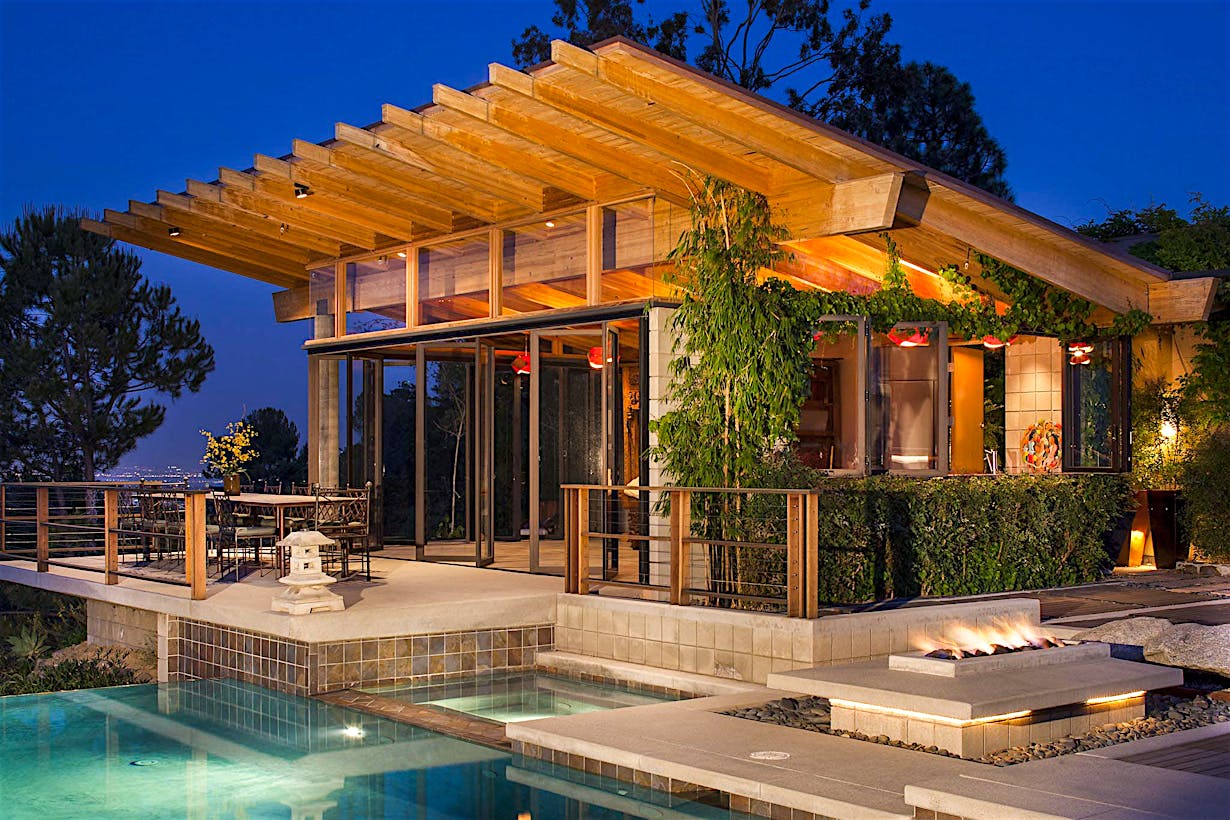 pool house design with collapsible glass doors
