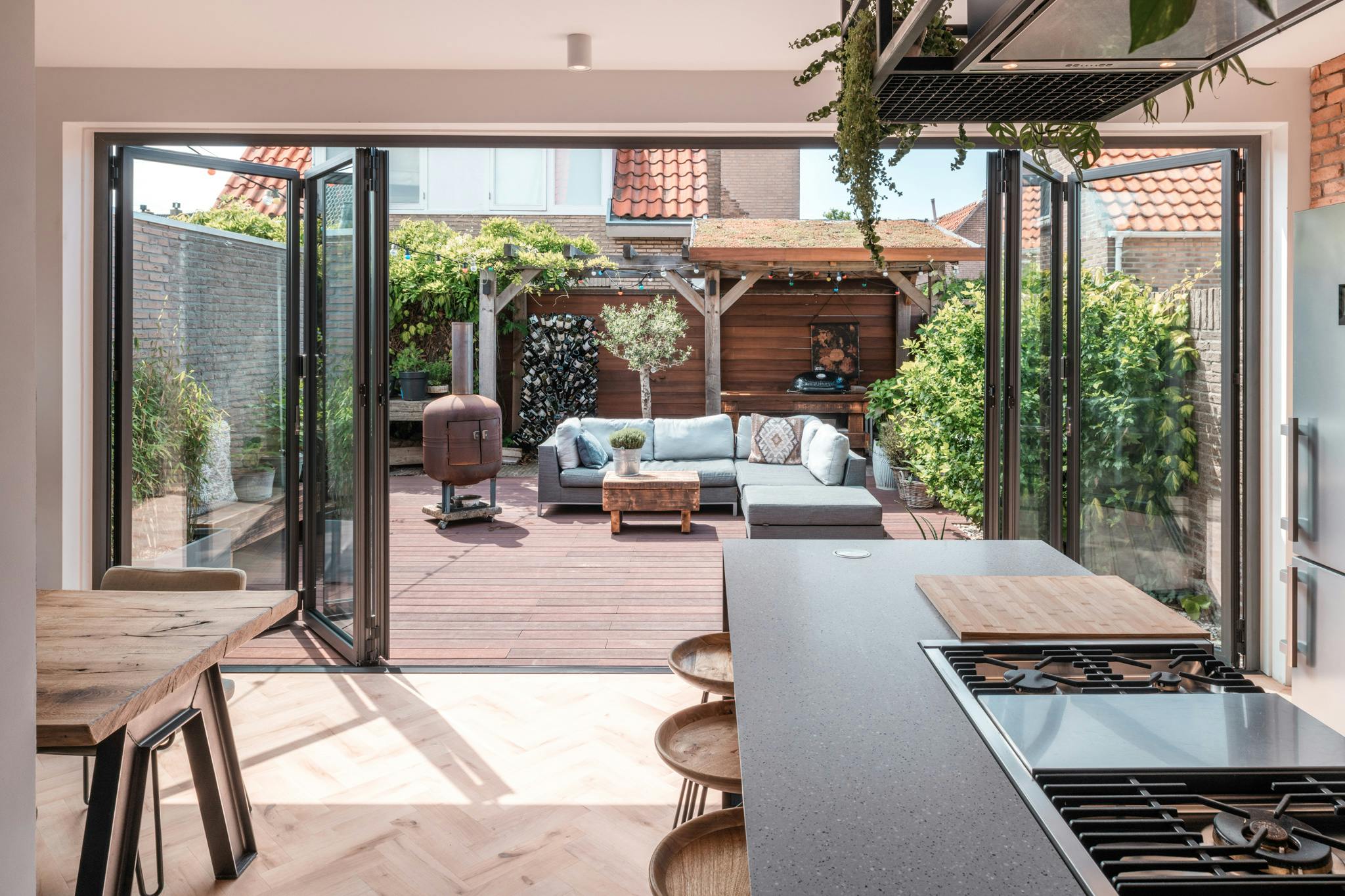 opening glass patio doors create outdoor lounge