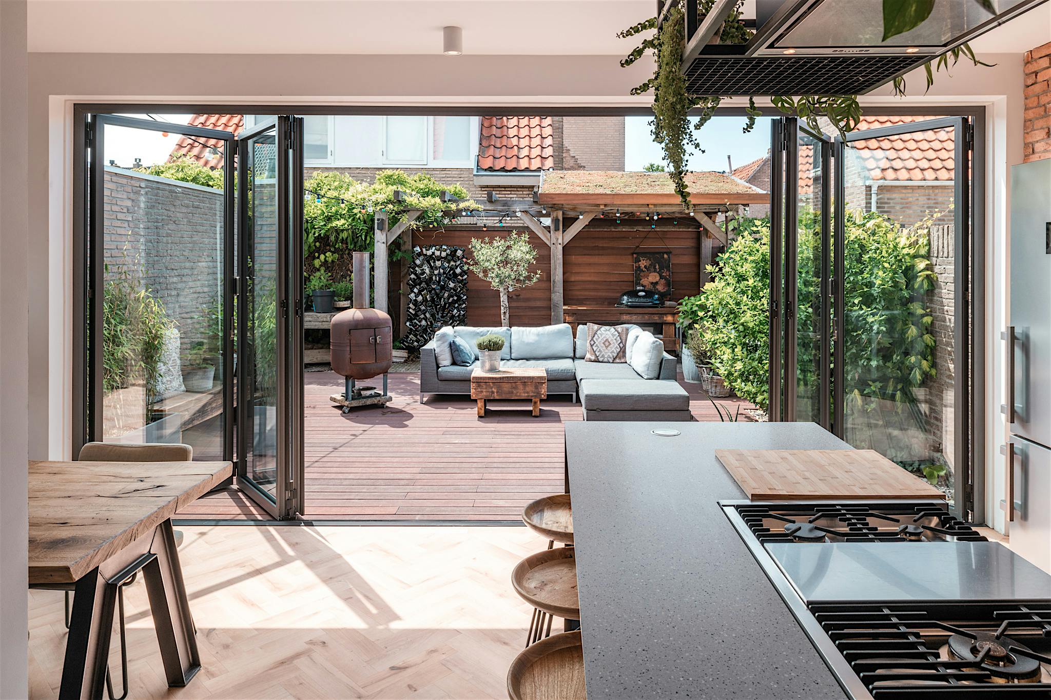 opening glass patio doors create outdoor lounge