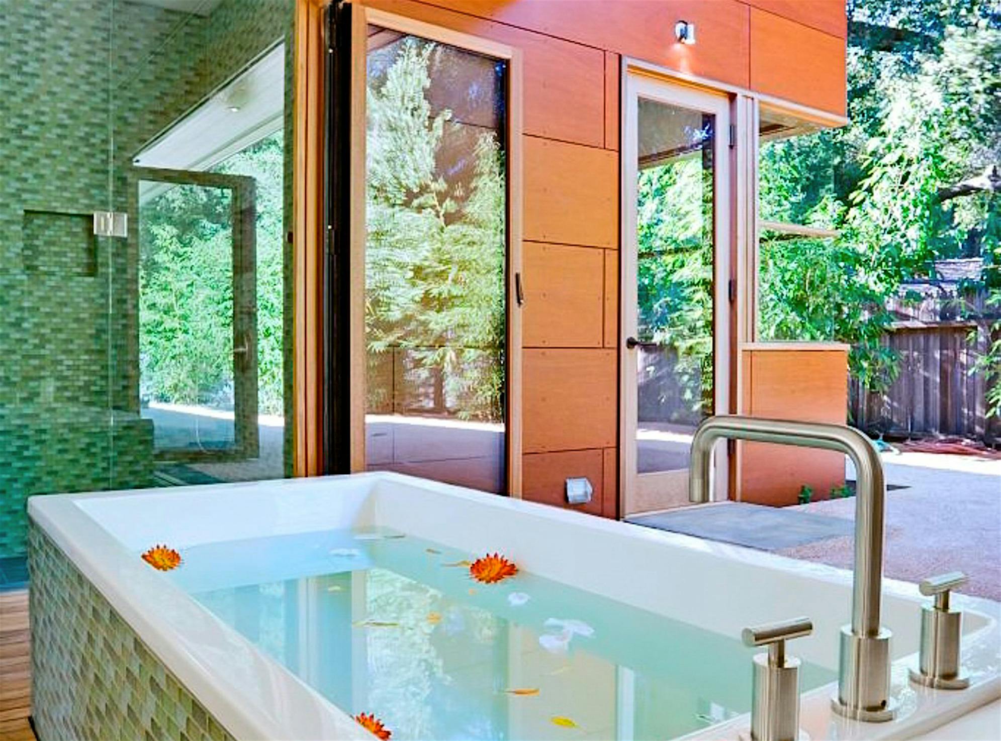 retractable glass doors in bathroom design