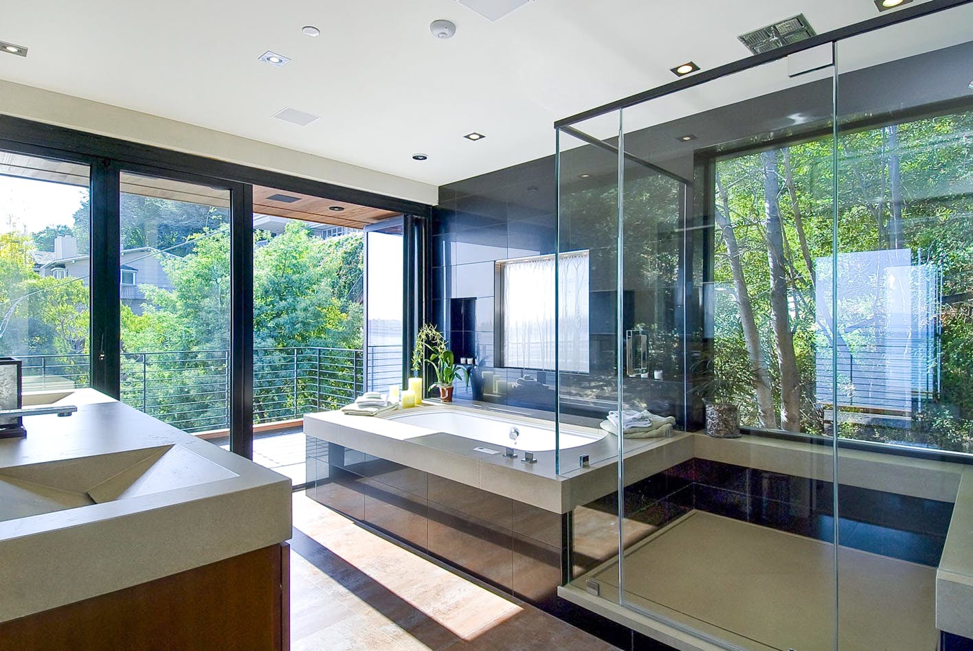 accordion style glass doors in residential bath design