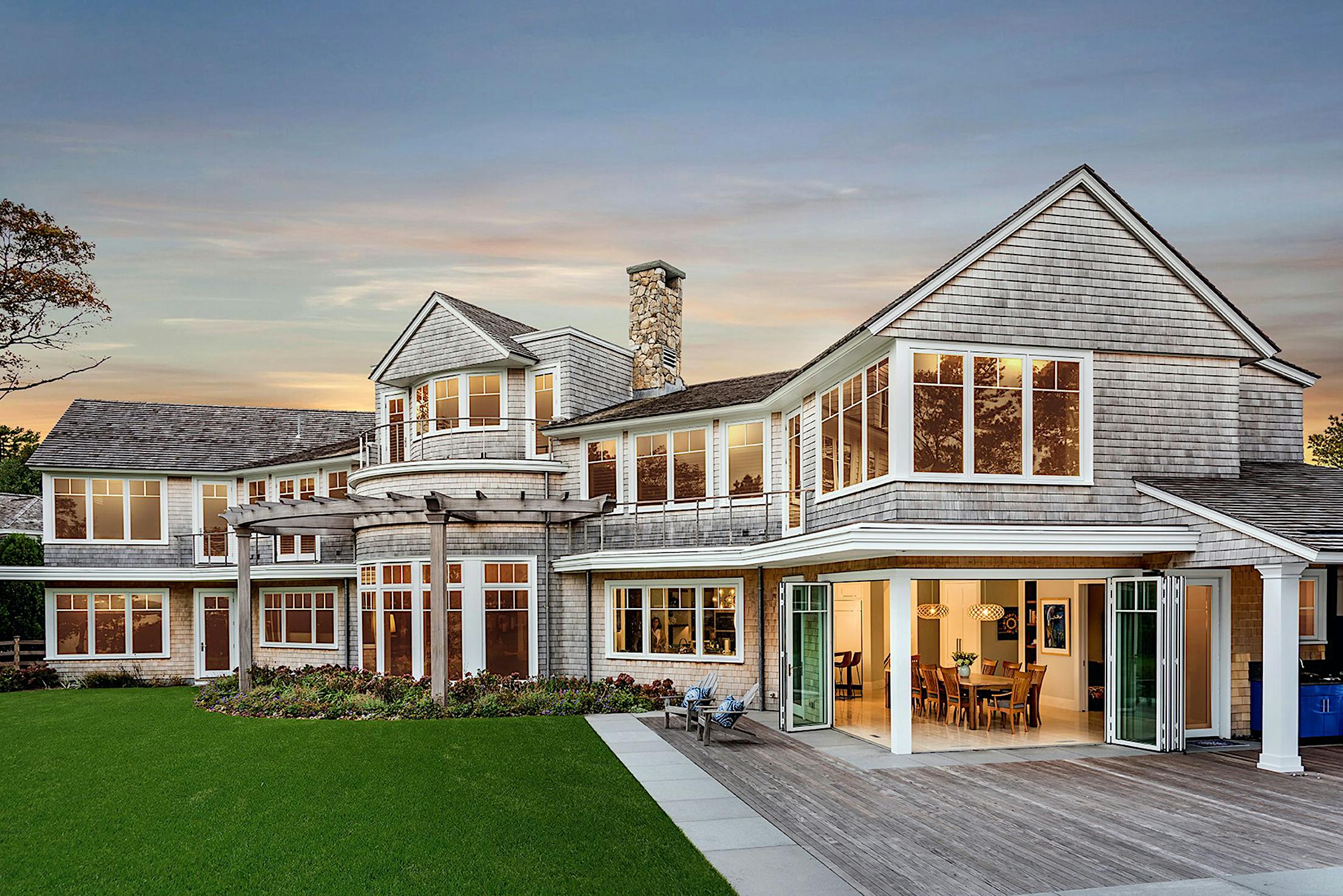 traditional home with aluminum bifolding doors