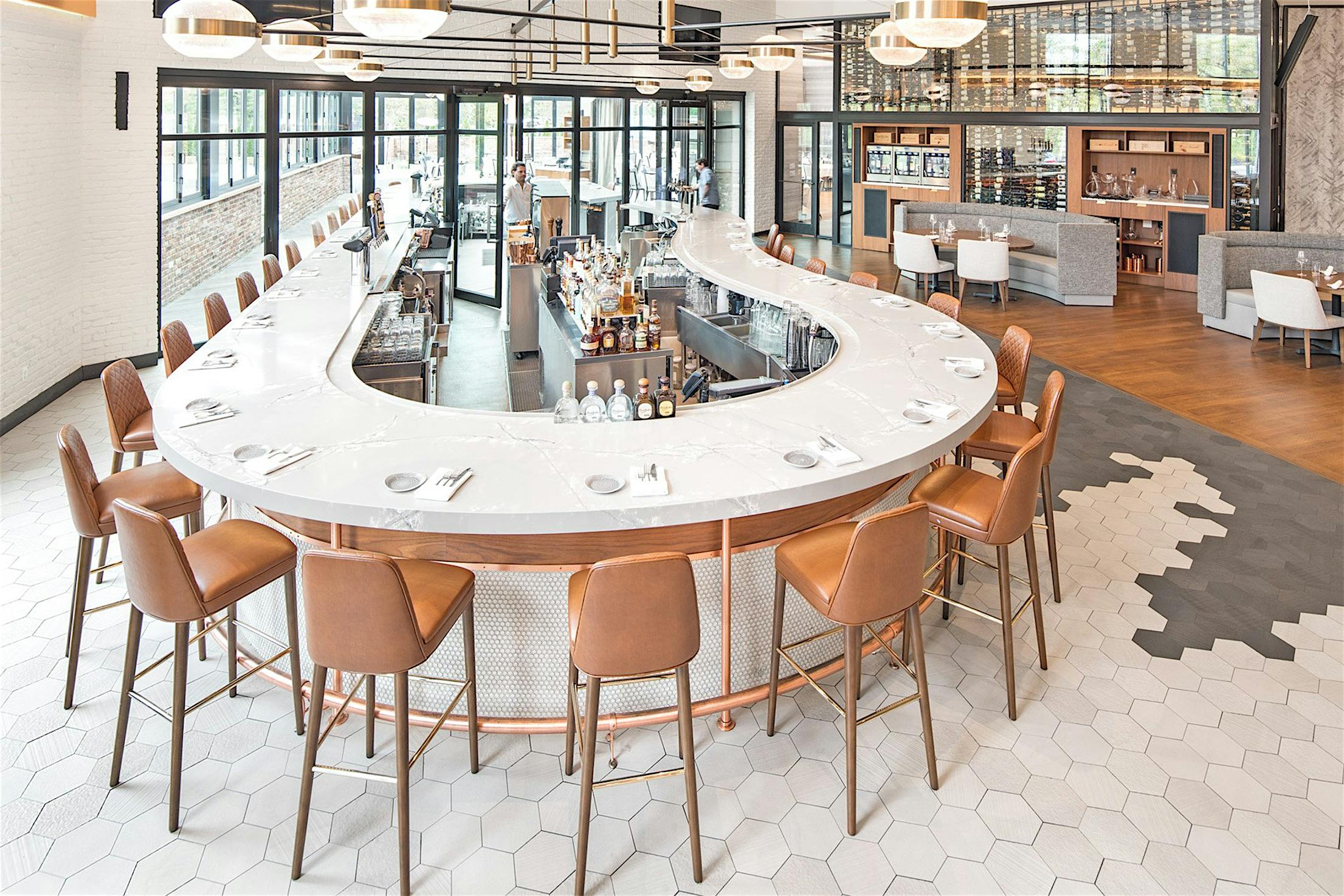 unique kindey-shaped bar with sliding glass wall