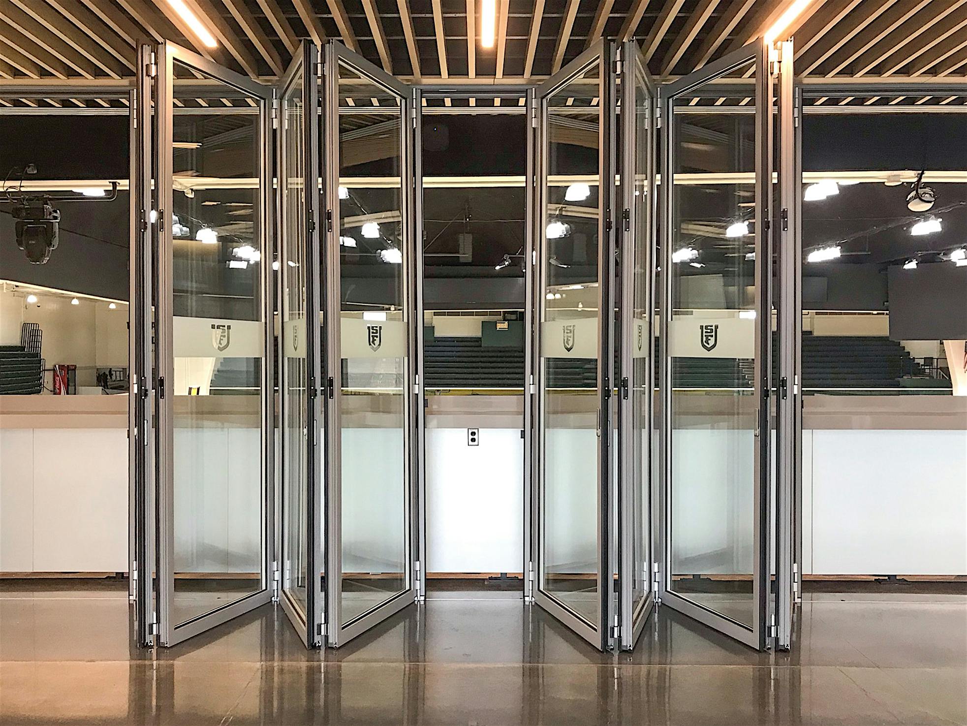 NanaWall FourFold panel sets in acoustic glass wall