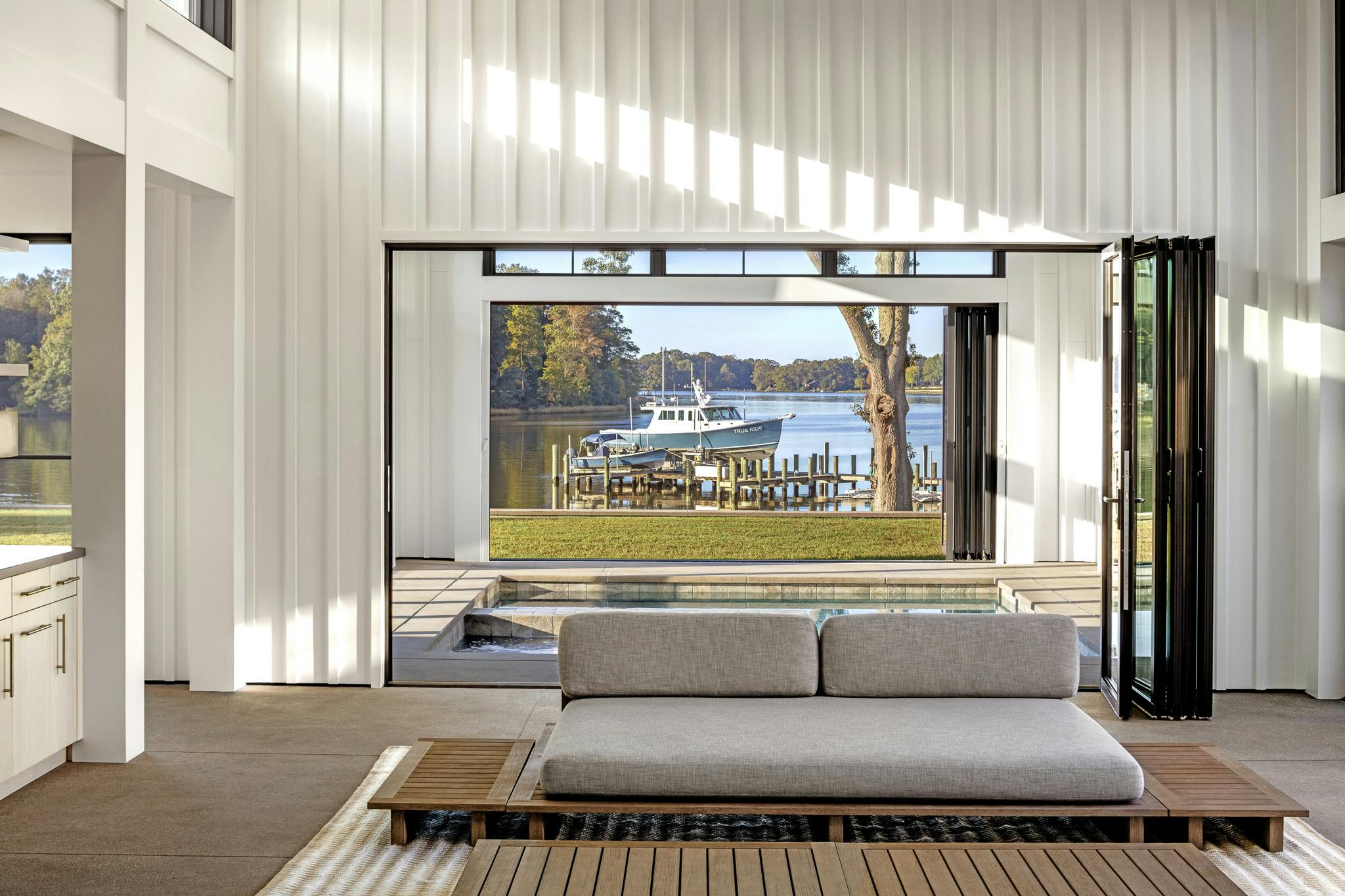 indoor outdoor pool with NanaWall aluminum framed folding doors