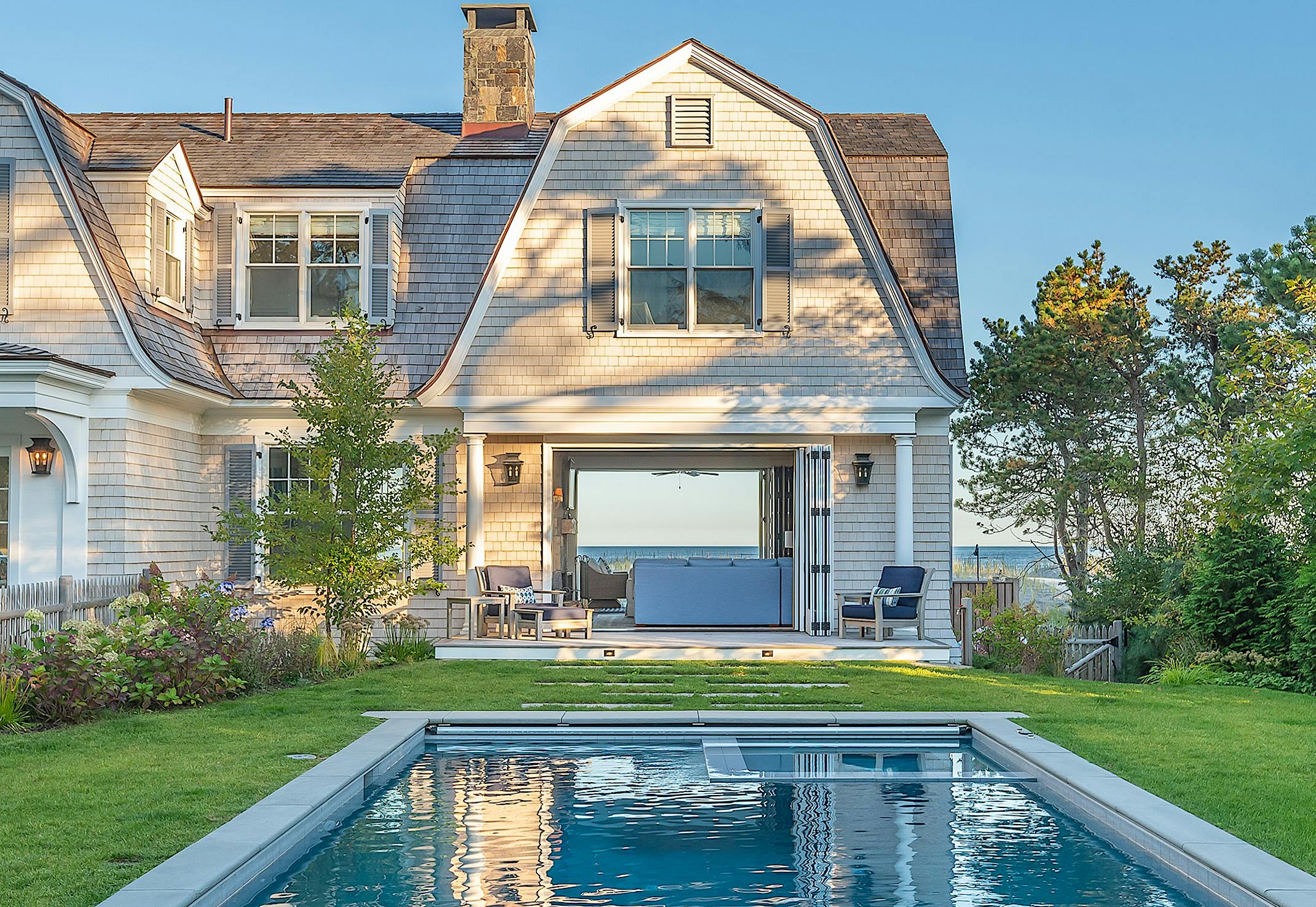 traditional home design with folding glass walls