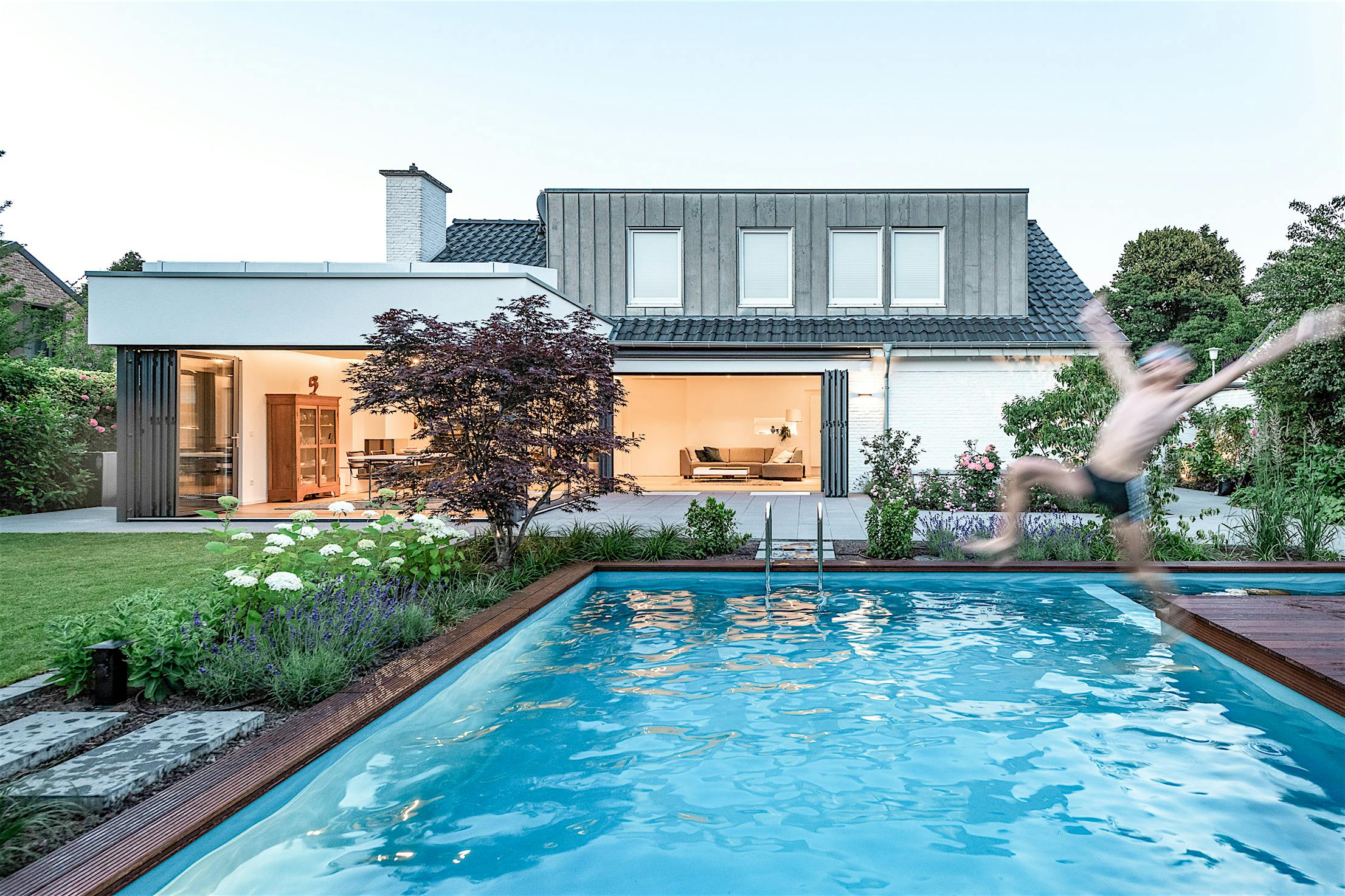 comtemporary home design with exterior opening glass walls