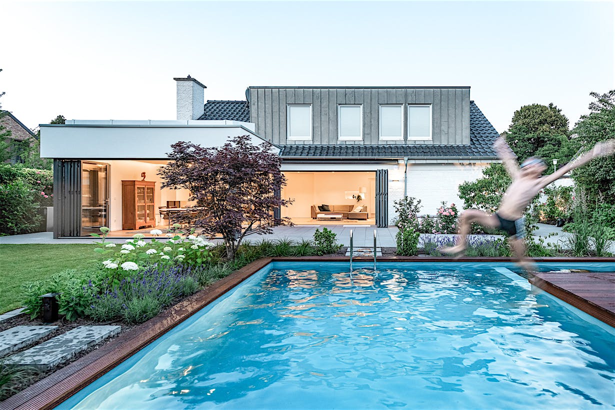 comtemporary home design with exterior opening glass walls