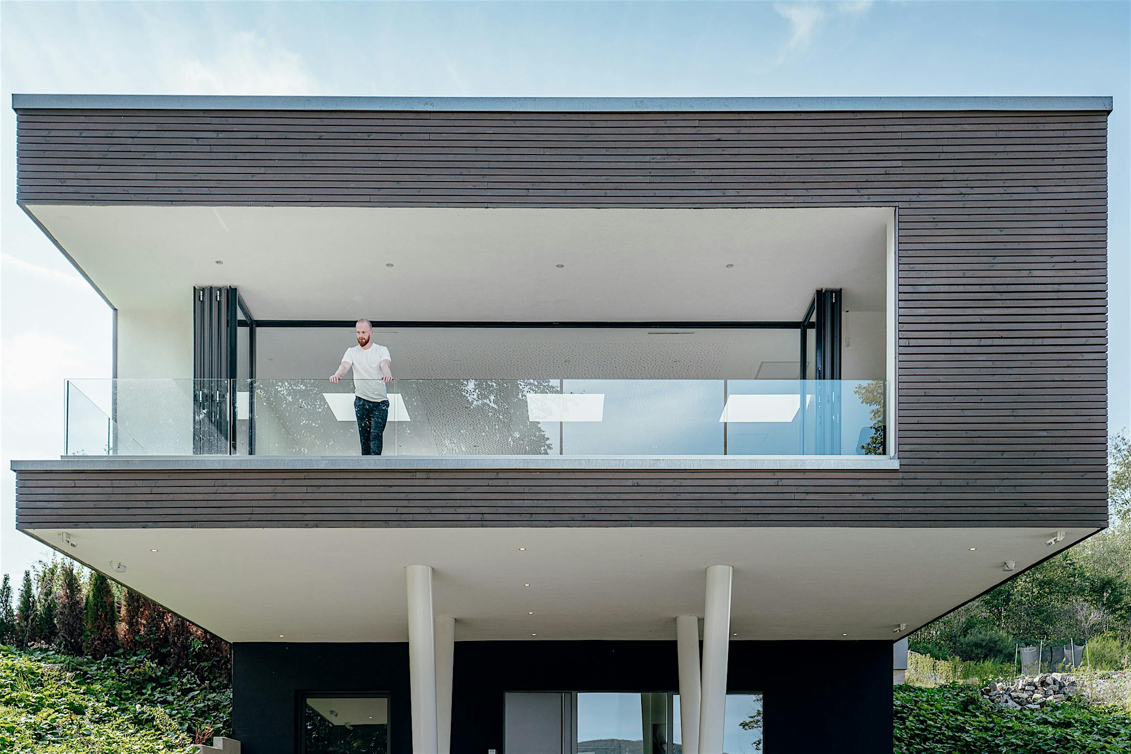 contemporary home with retractable glass walls