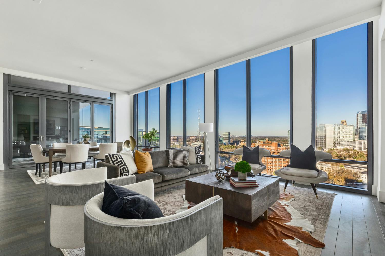 luxury condo with NanaWall opening glass walls onto terrace