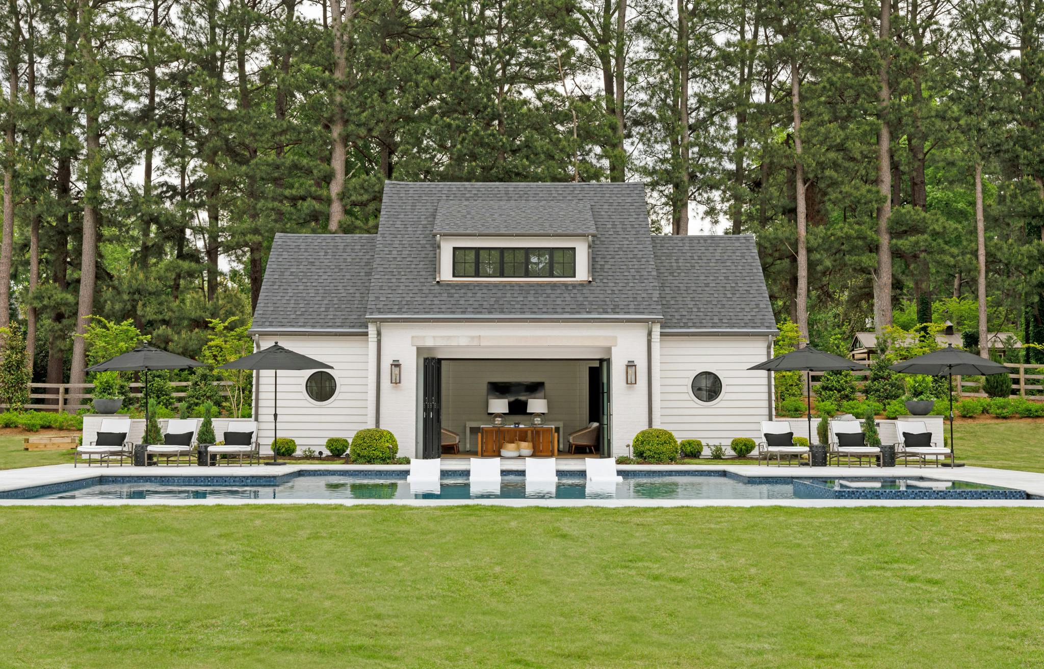 operable glass walls in pool house design