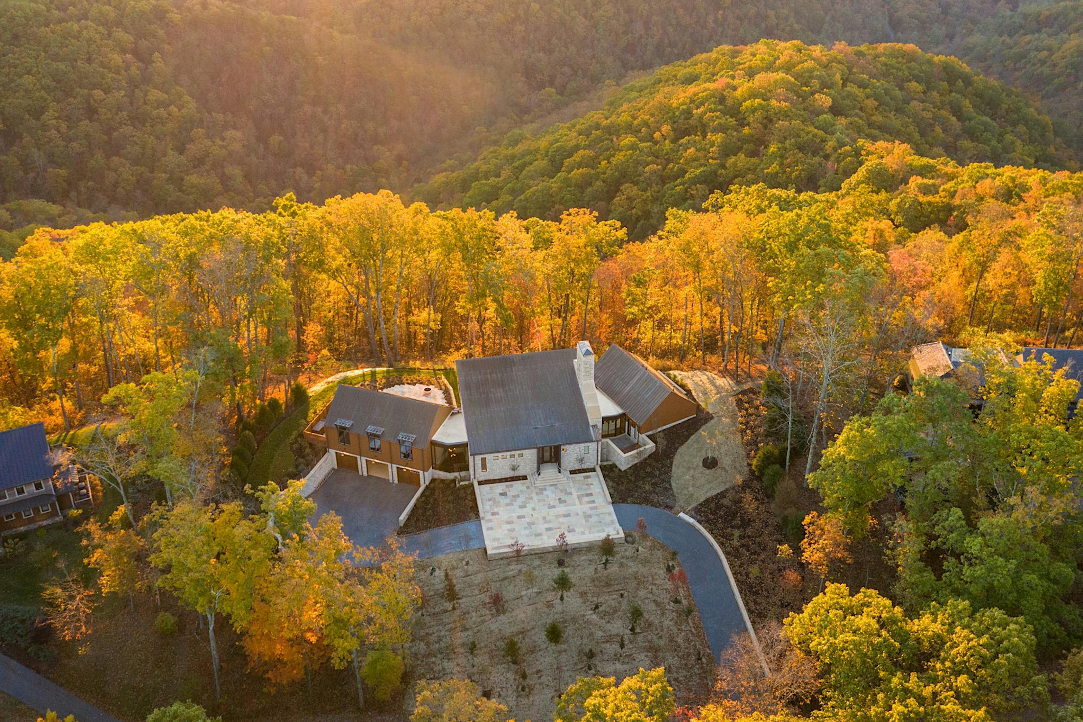 drone view of home with NanaWall minimal glass walls