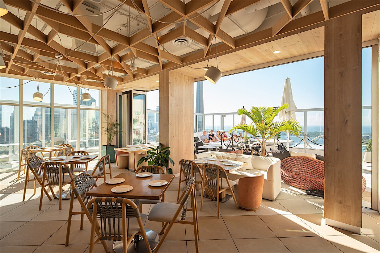 Kost Restaurant with opening glass walls rooftop design