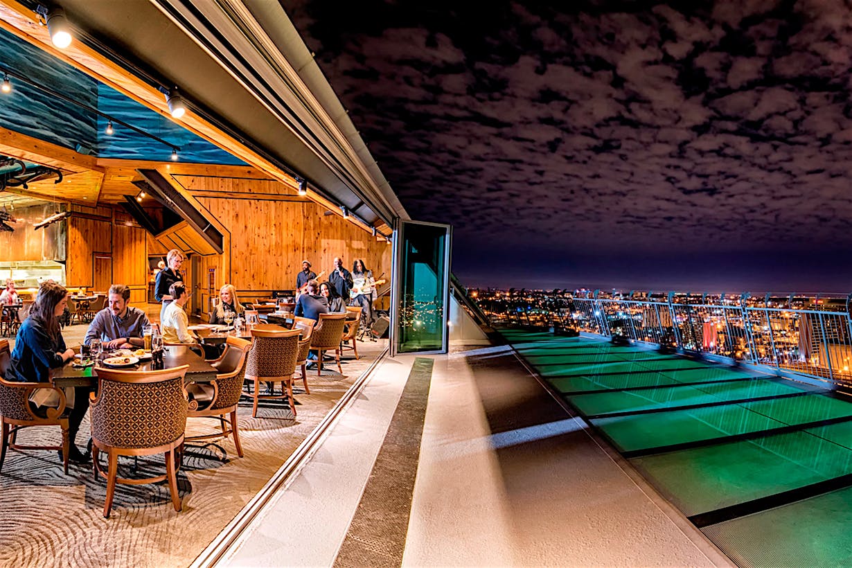 performace-driven rooftop opening glass walls