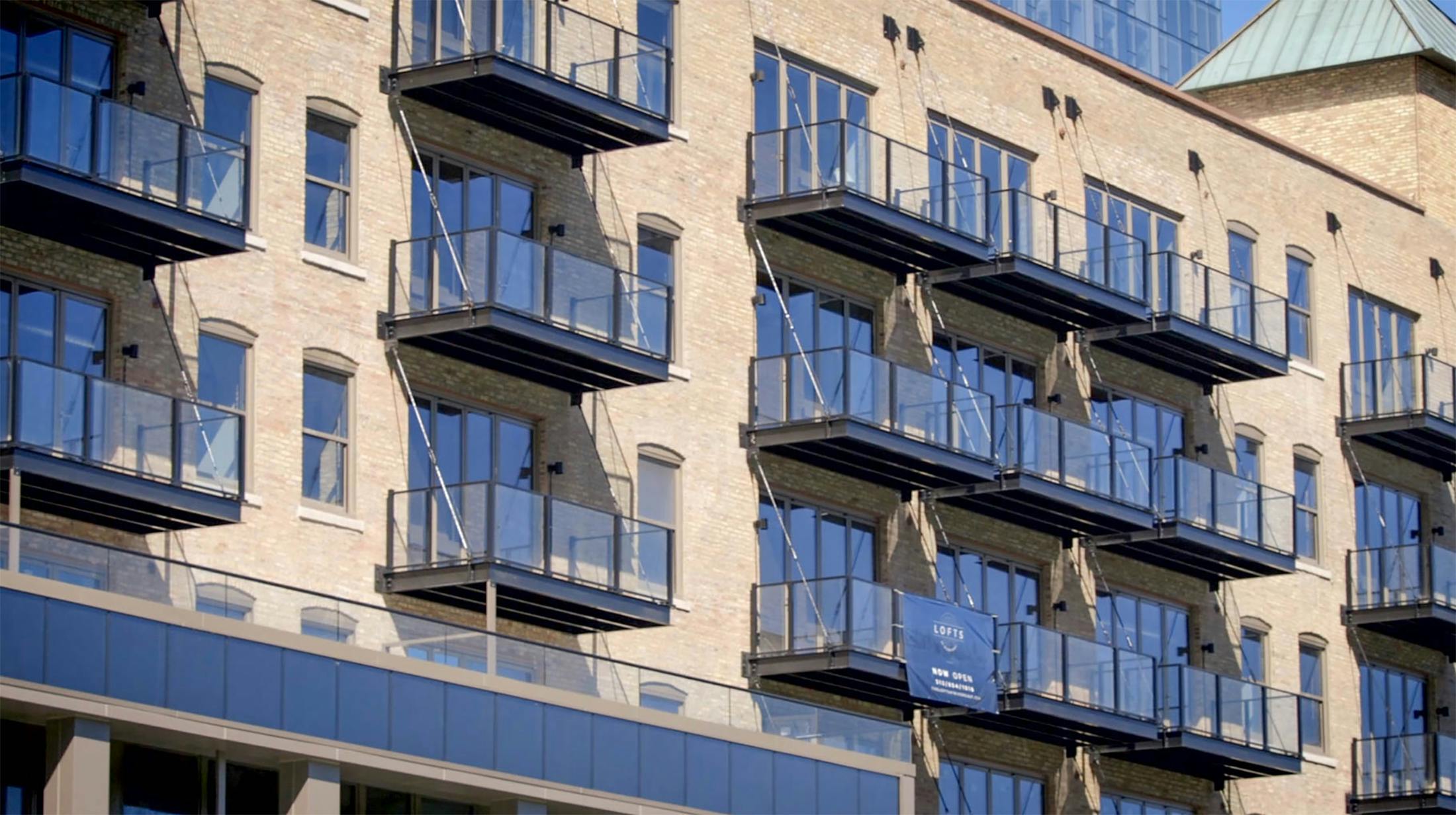 multifamily balcony design with NanaWall folding glass walls