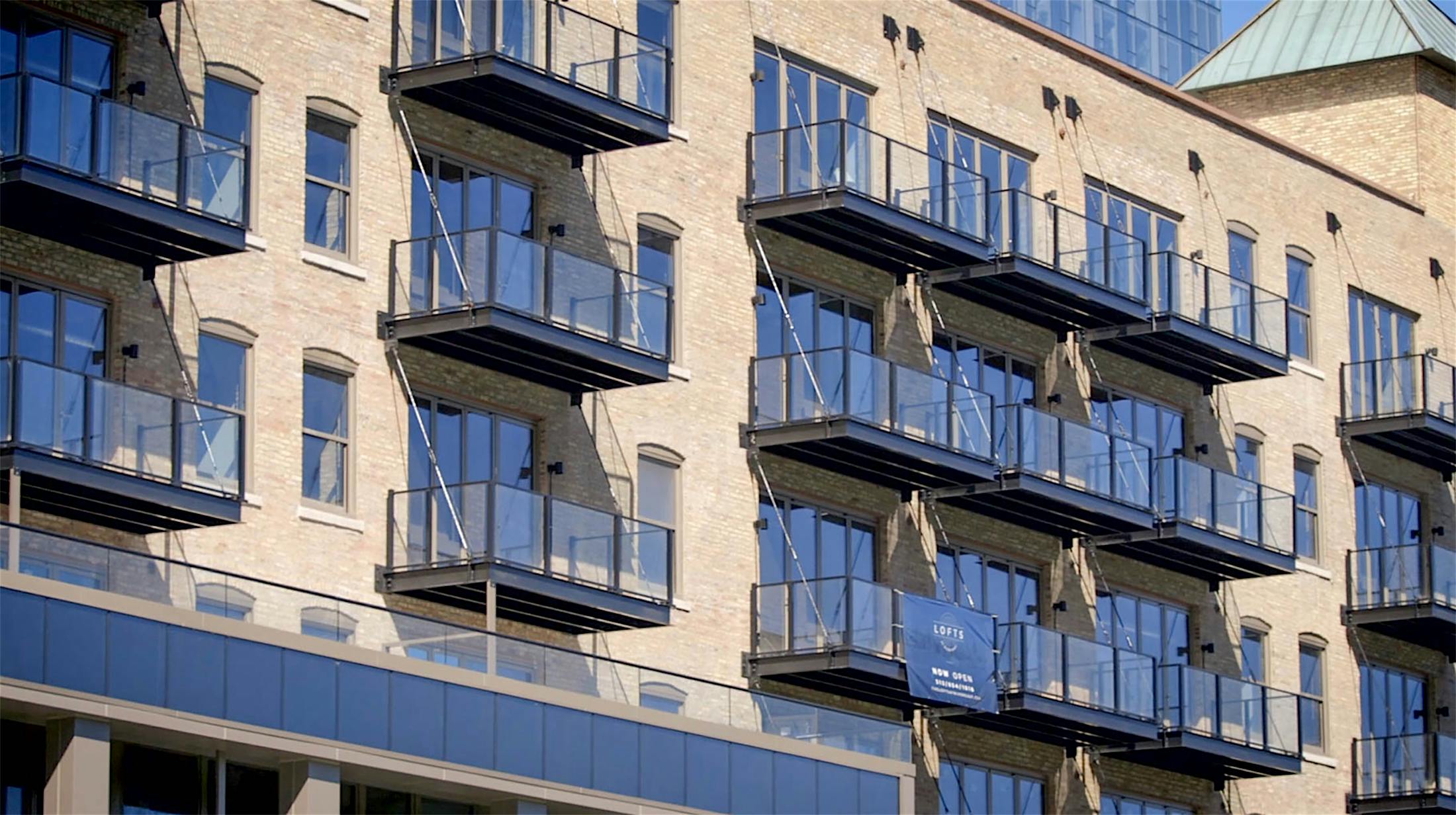 multifamily balcony design with NanaWall folding glass walls