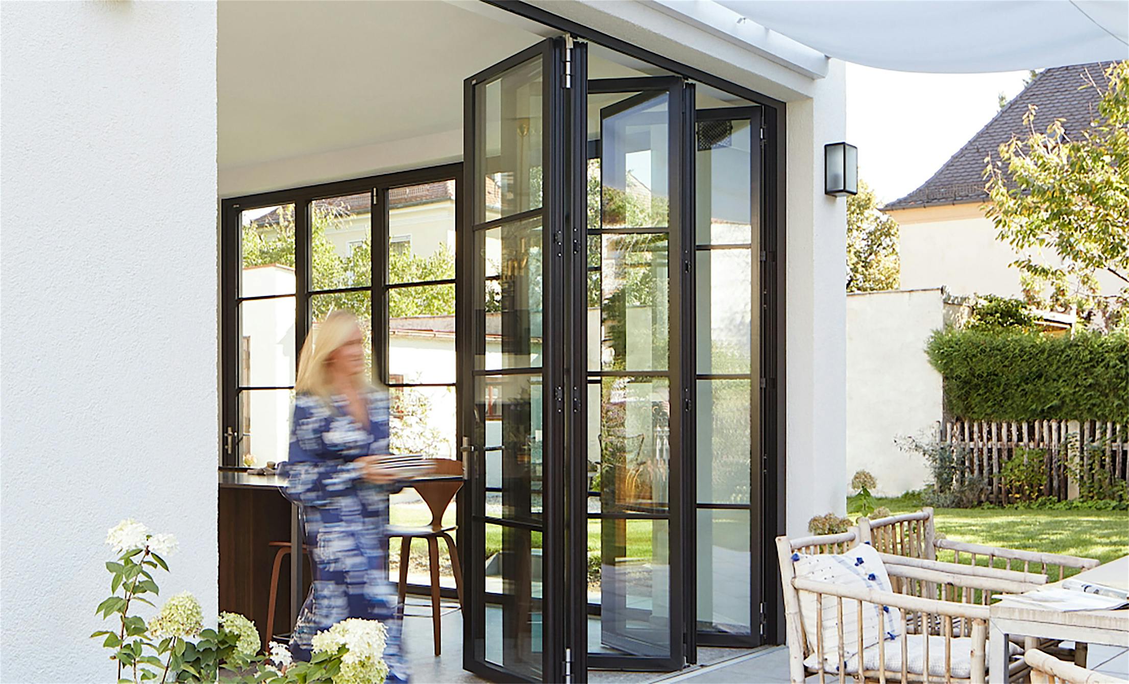Modern Design with black framed steel look folding glass walls
