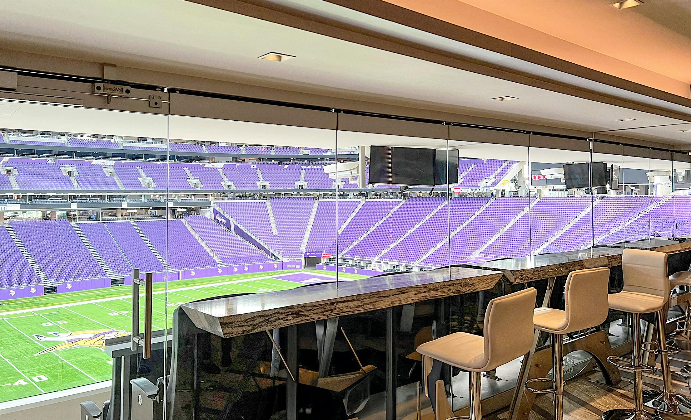 frameless stacking glass wall systems at Minnesota Vikings