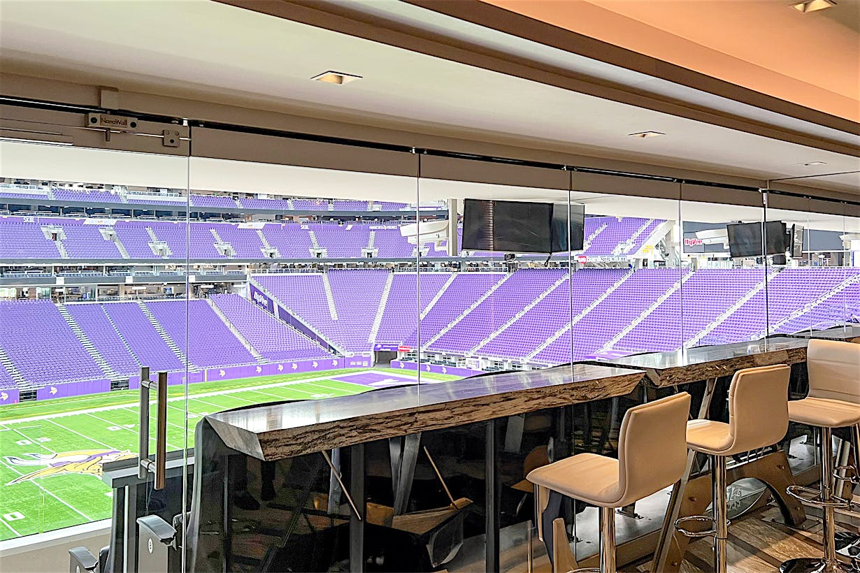 frameless stacking glass wall systems at Minnesota Vikings