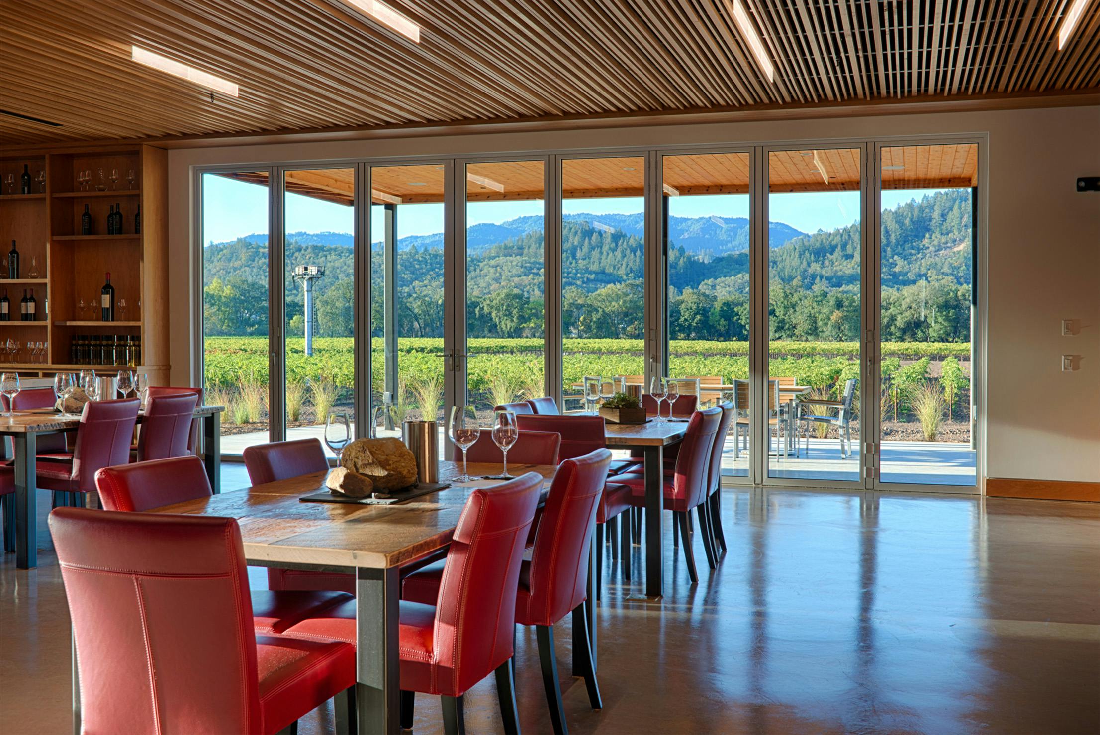 retractable glass walls in winery tasting room