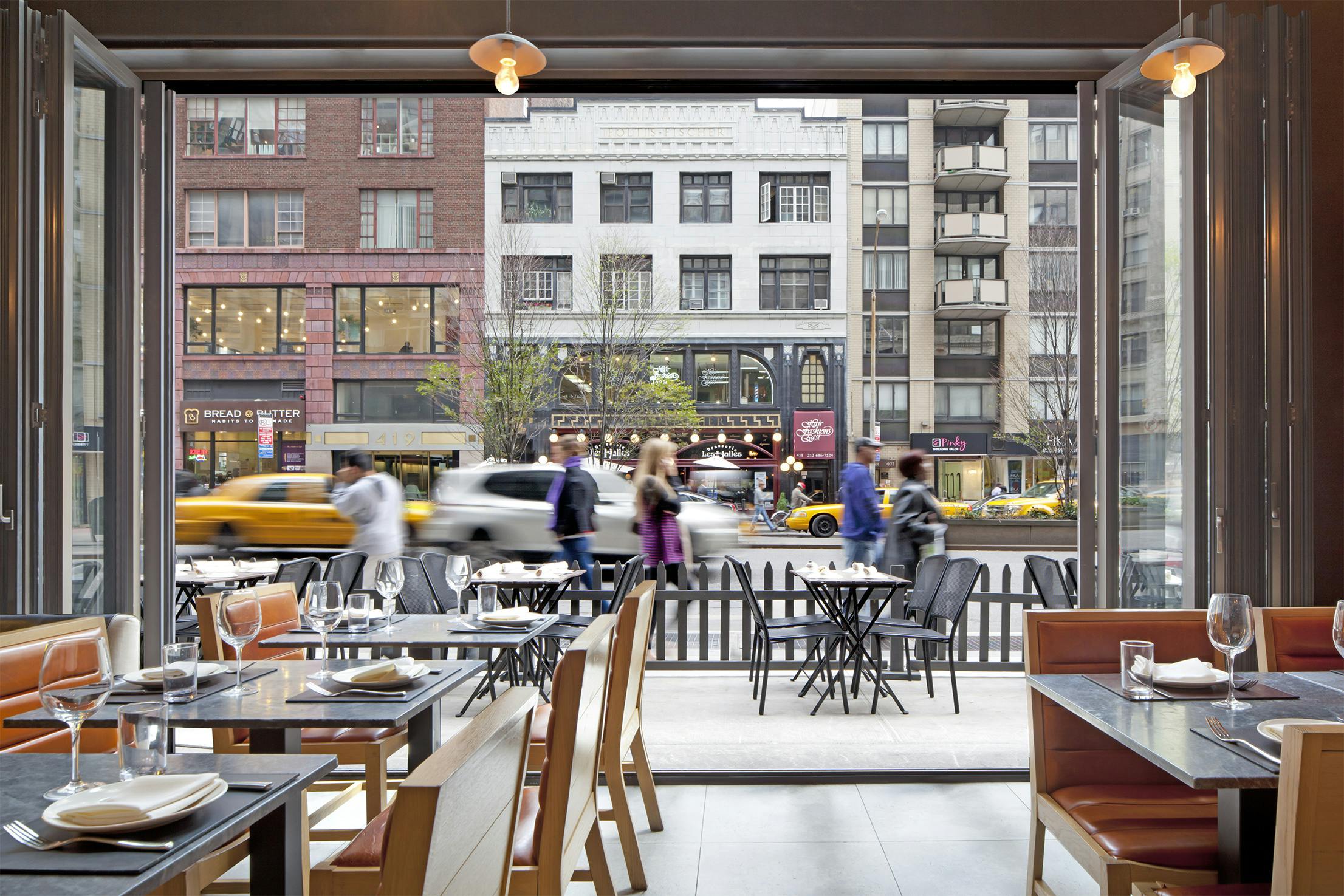 outdoor dining NYC with commercial glass walls