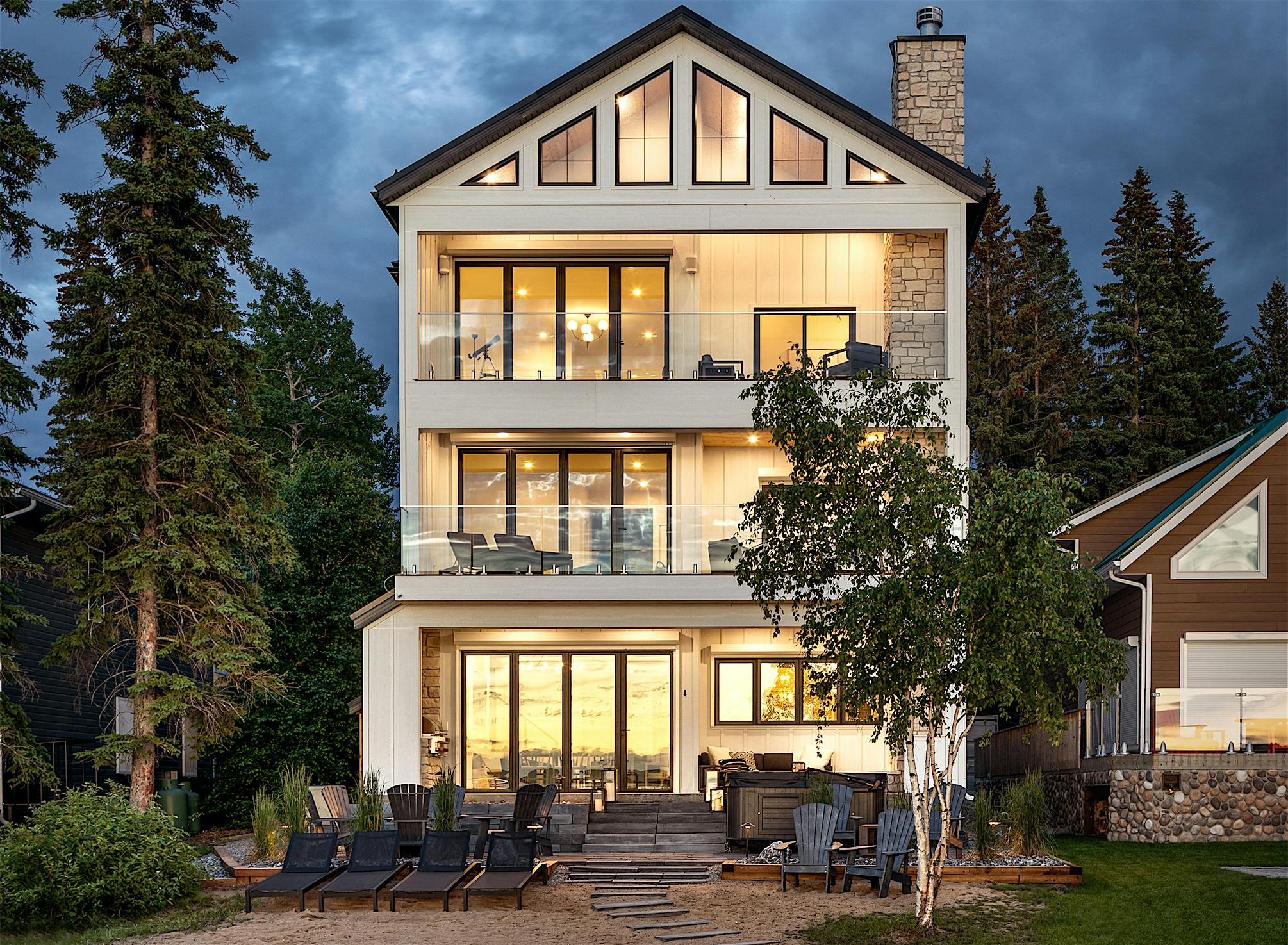 lakefront home design with NanaWall glass walls