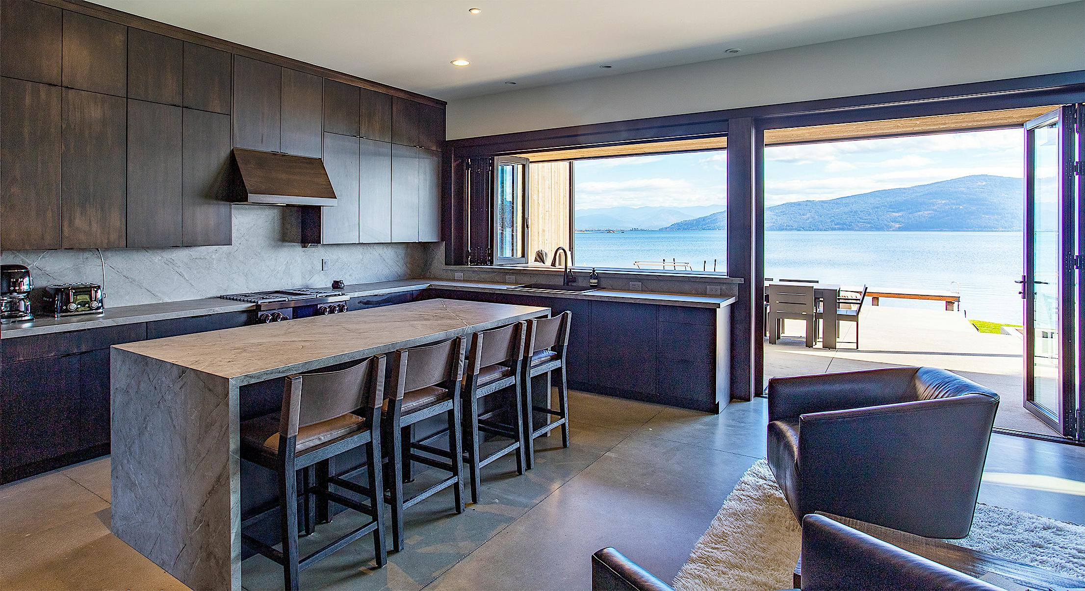 folding glass wall systems in lake home