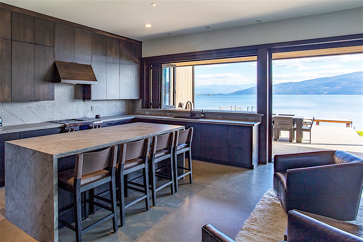 folding glass wall systems in lake home