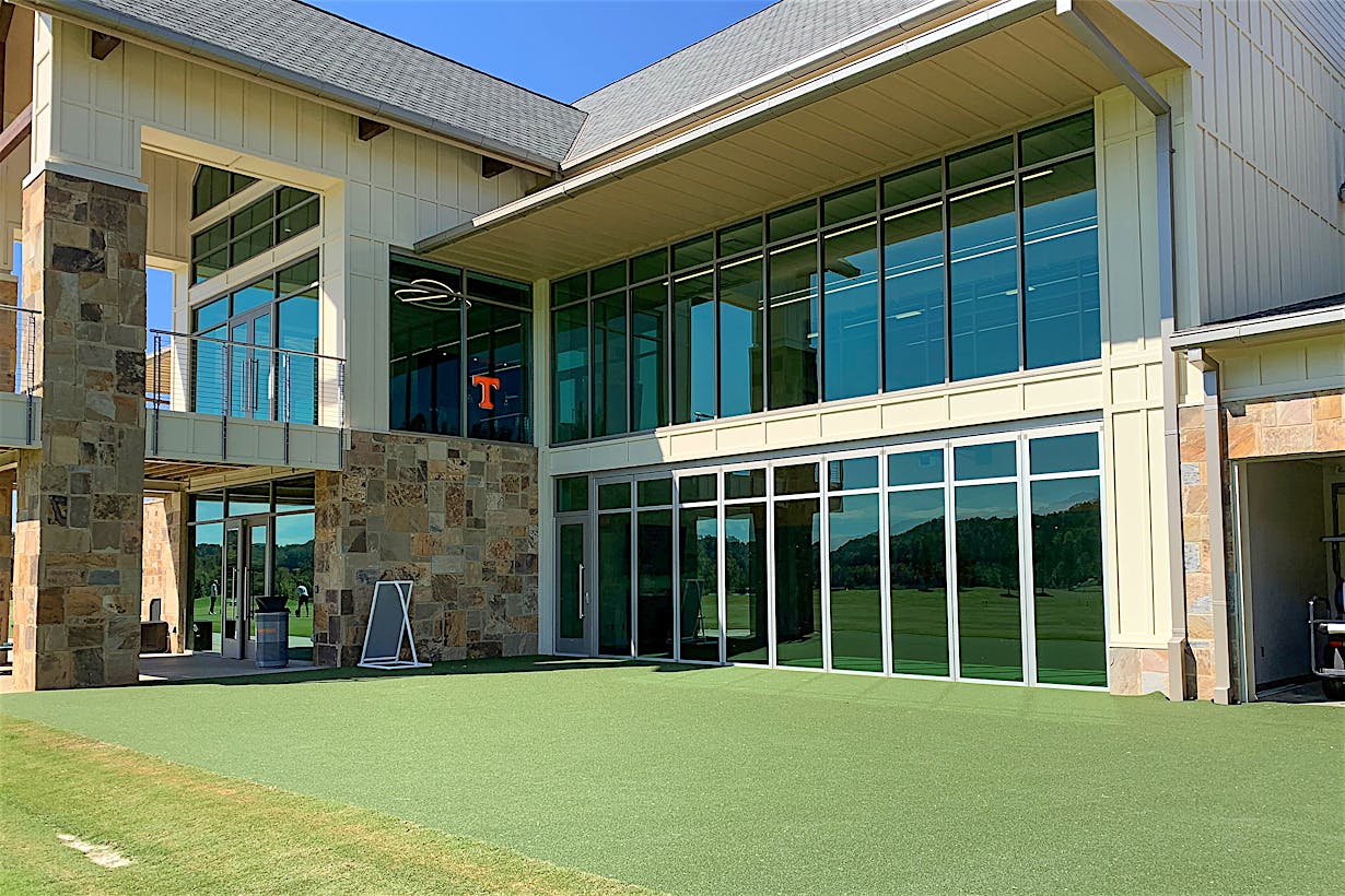 indoor outdoor putting green with NanaWall sliding glass walls