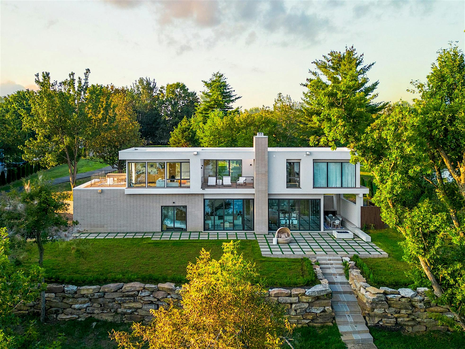 Lakefront home with glass wall systems