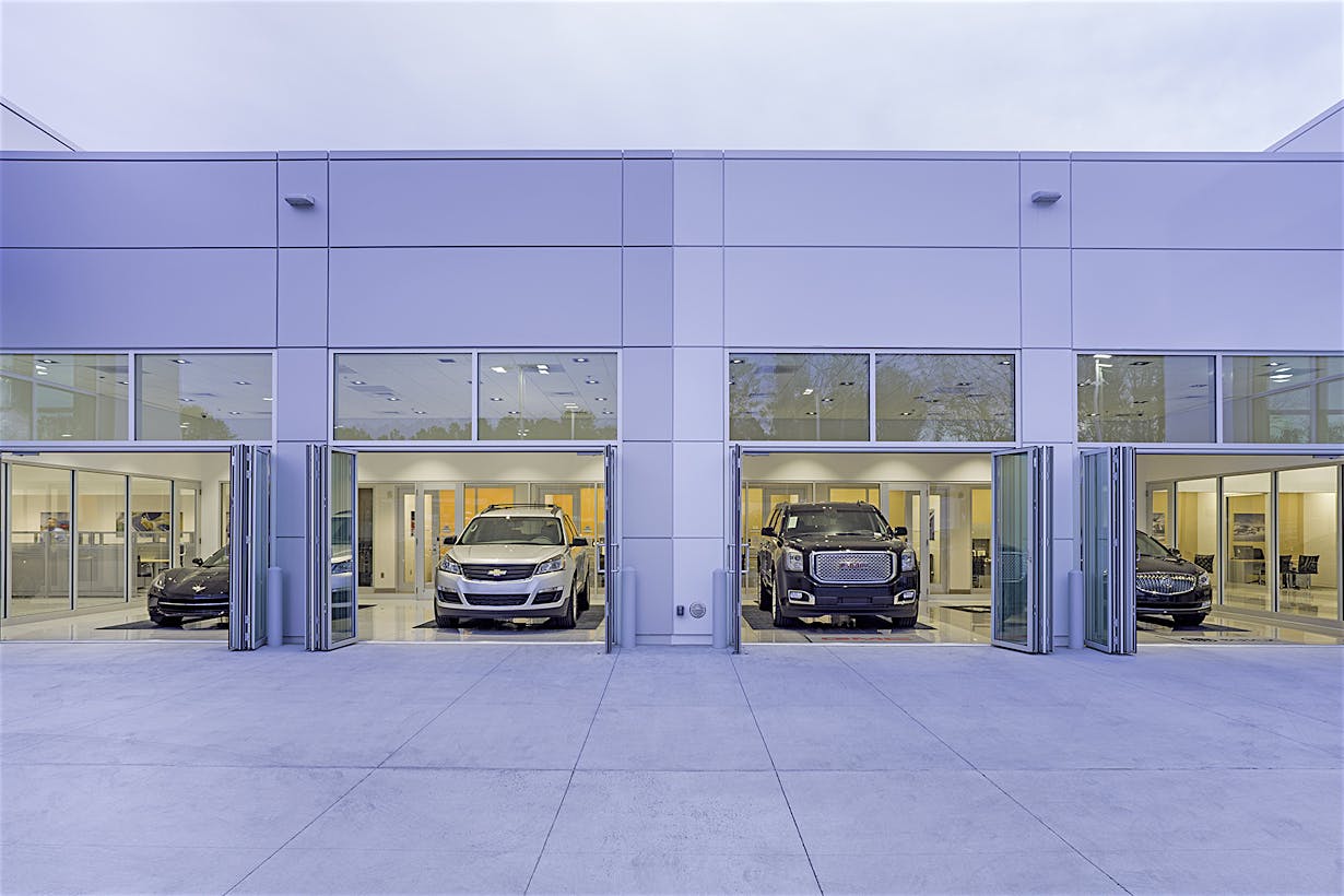 commercial glass doors in auto dealership design