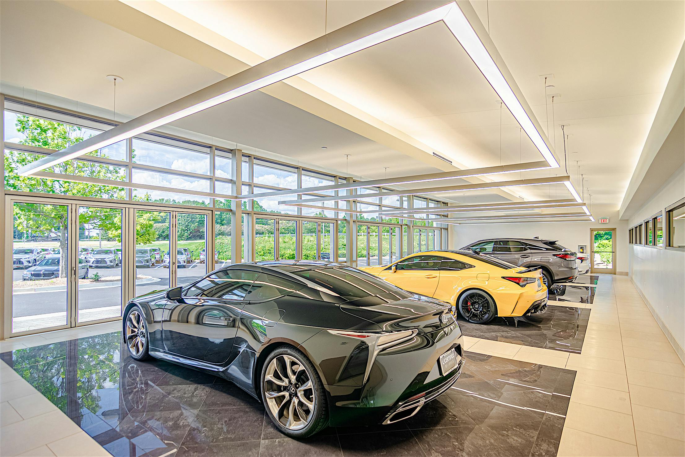 auto showroom design with commercial opening glass doors