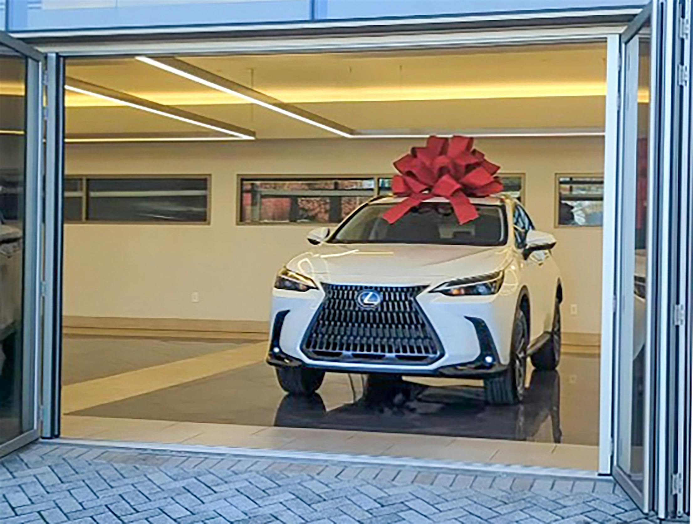 Lexus drive off experience with commercial opening glass door