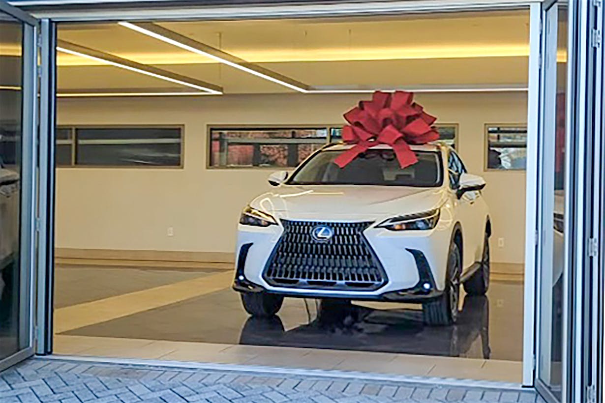 Lexus drive off experience with commercial opening glass door