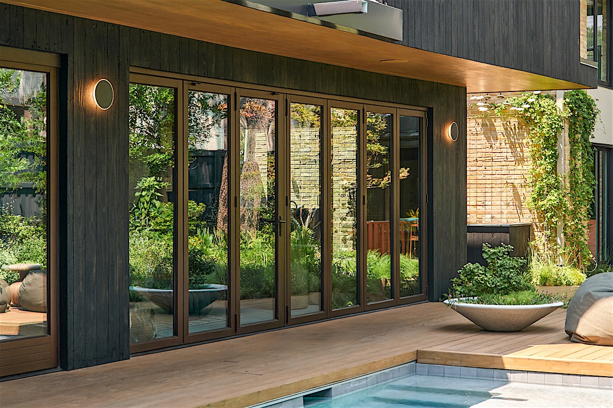 opening glass door system in pool house design