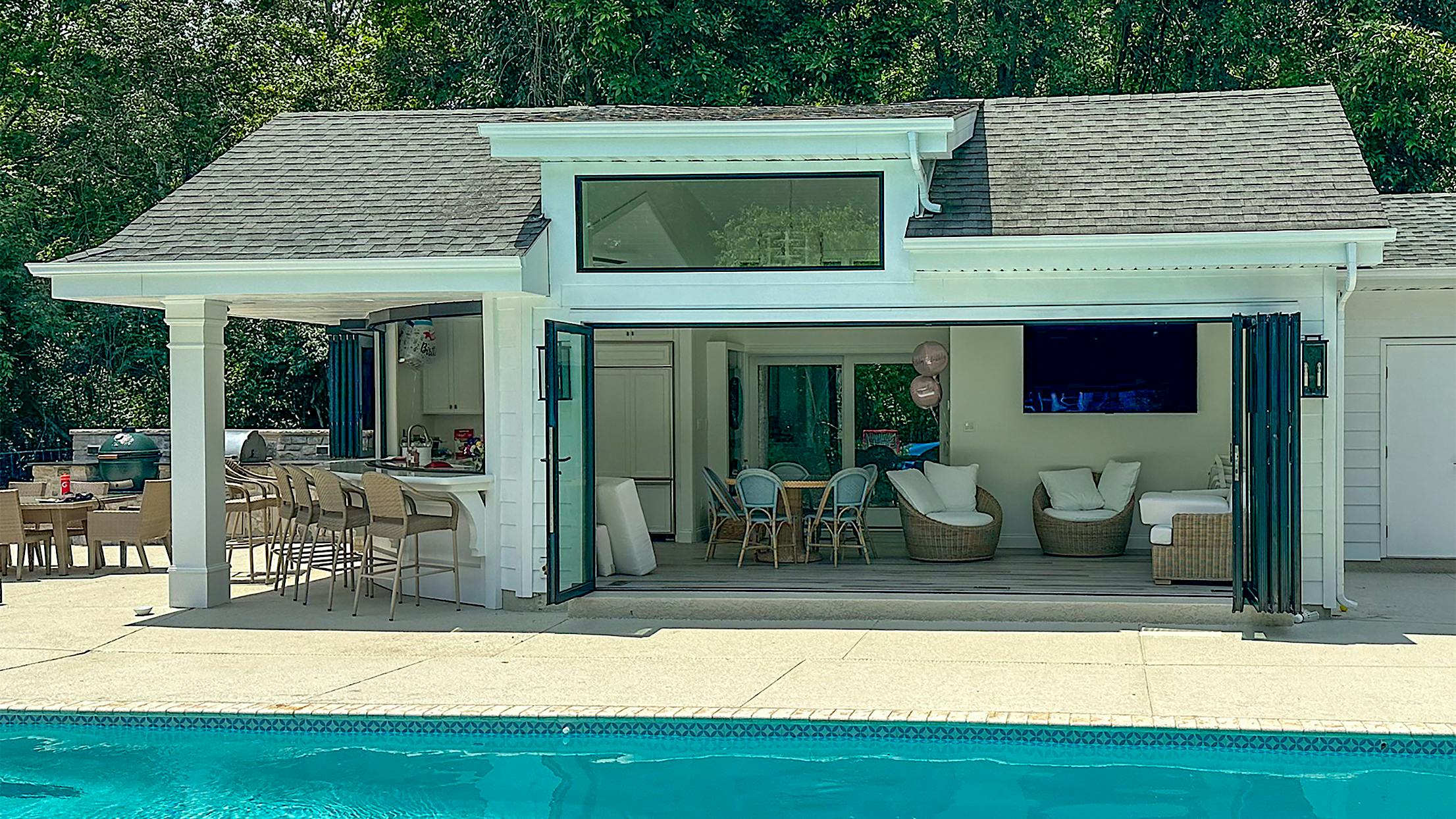 pool house designe with folding and sliding opening glass doors