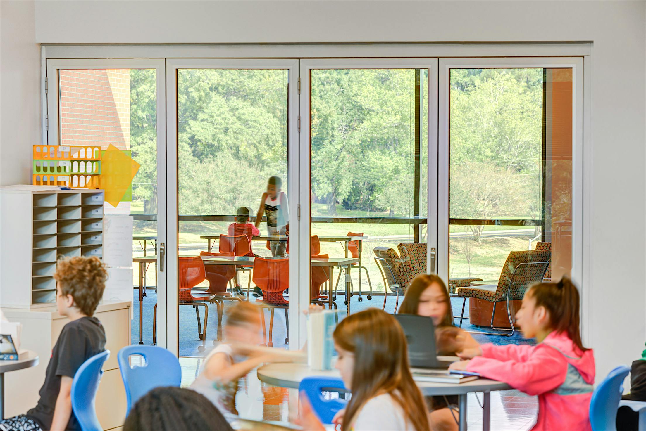 bifold glass wall system in active classroom