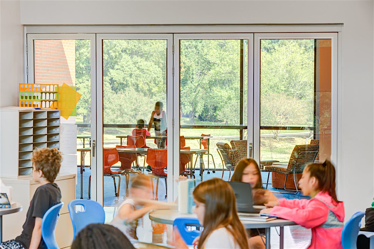 bifold glass wall system in active classroom