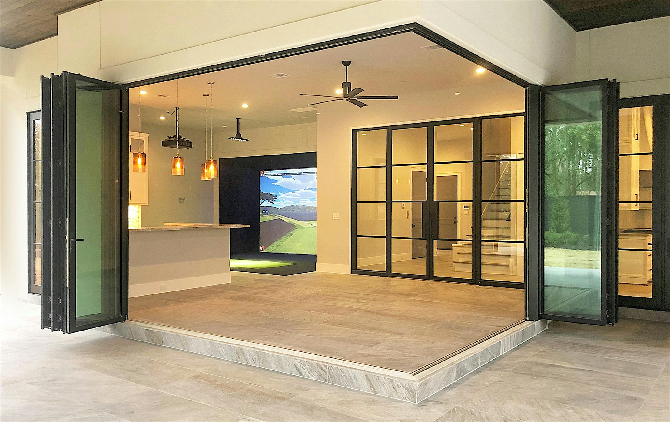 Custom home with residential folding glass door systems