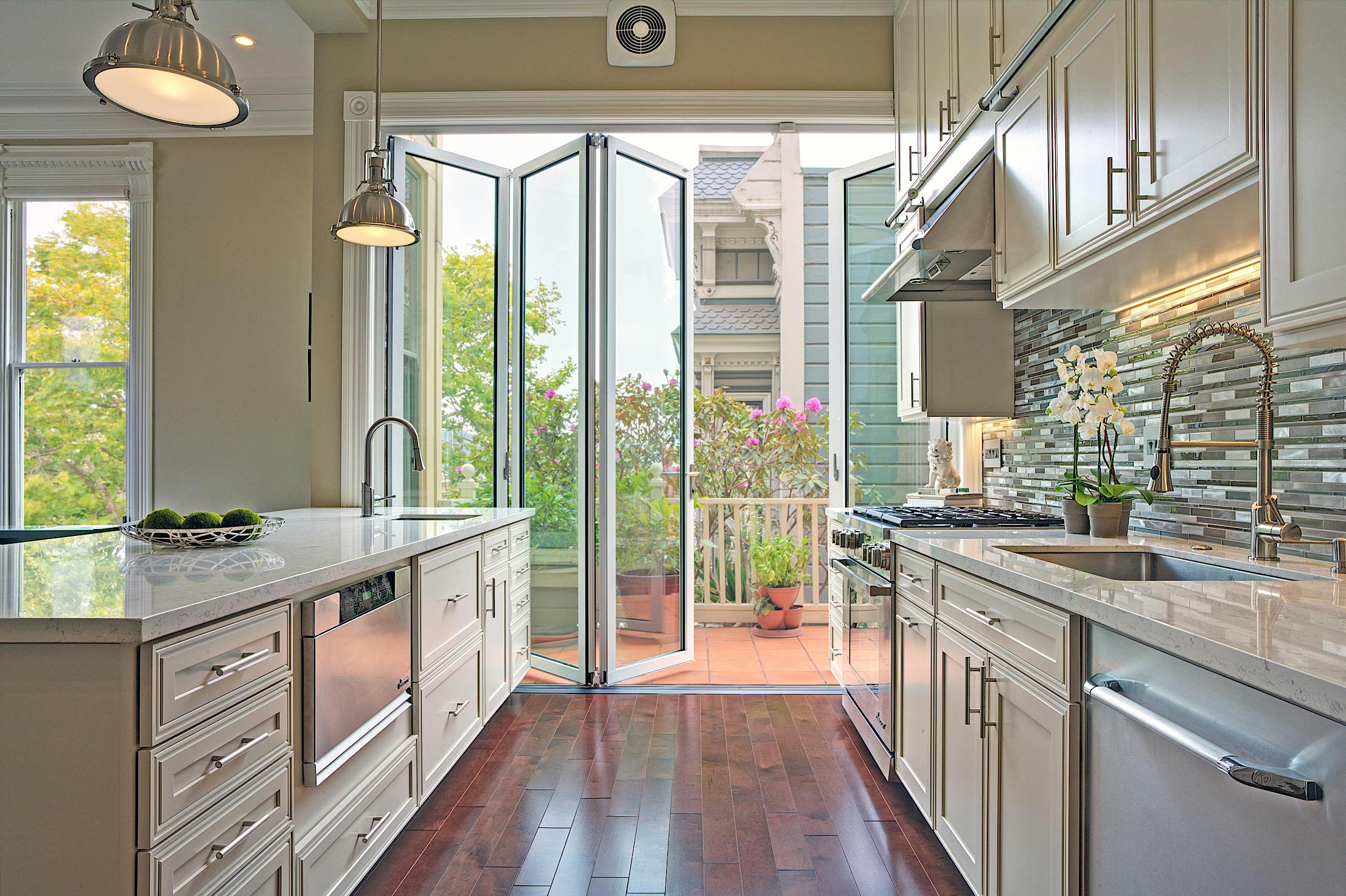 modern kitchen with folding glass wall