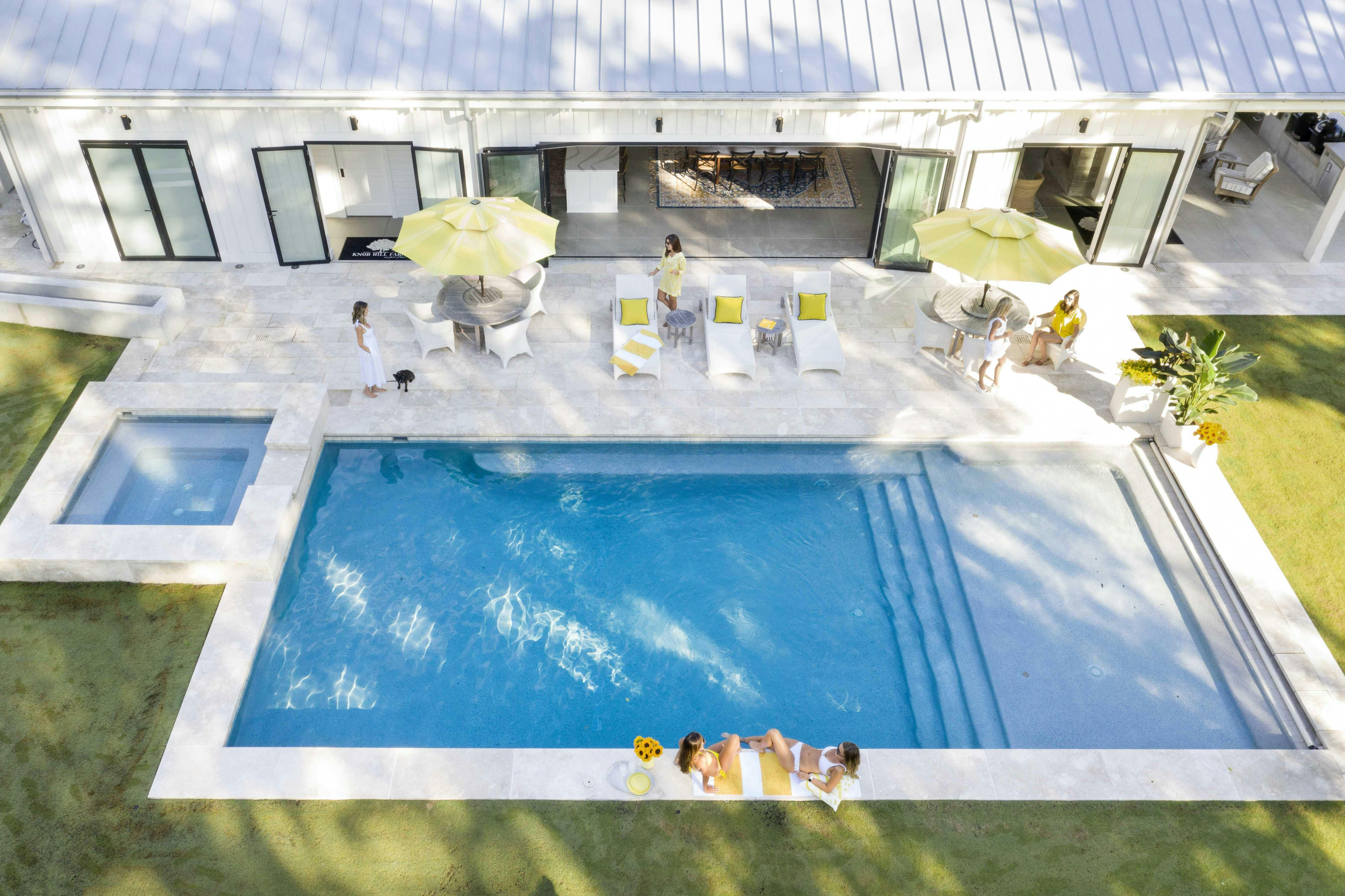 folding-glass-wall-opening-to-pool