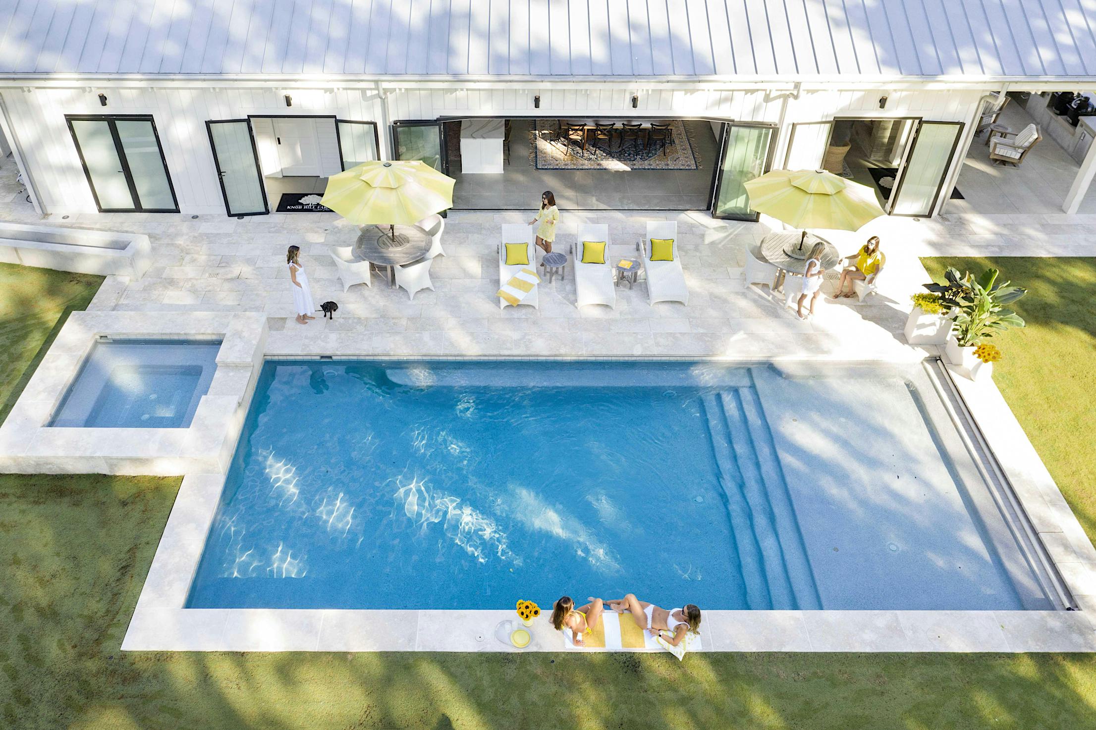 folding-glass-wall-opening-to-pool