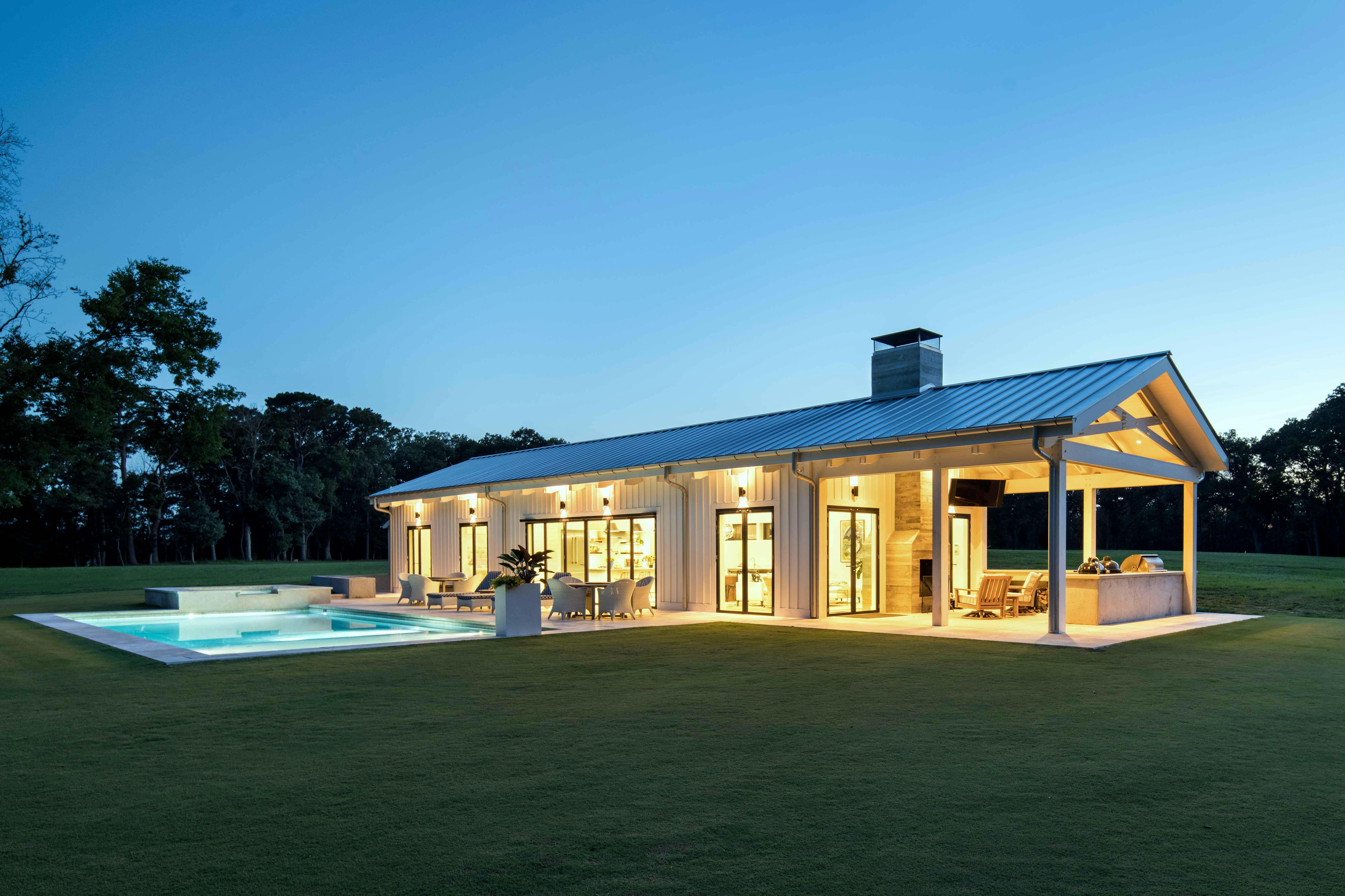 illuminated-pool-house-with-NanaWall-folding-glass-walls