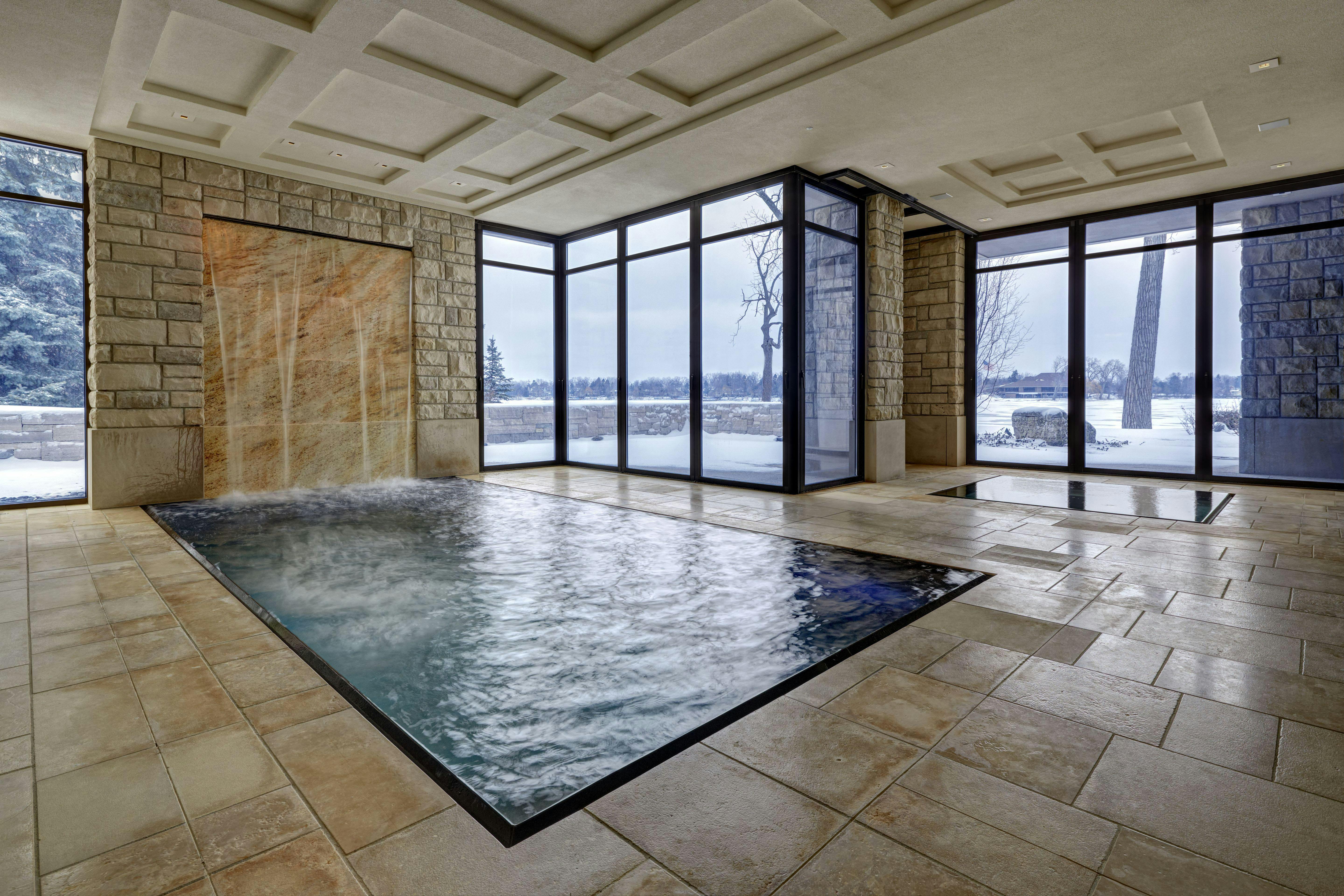 Single track sliding glass walls in West Bloomfield Pool House