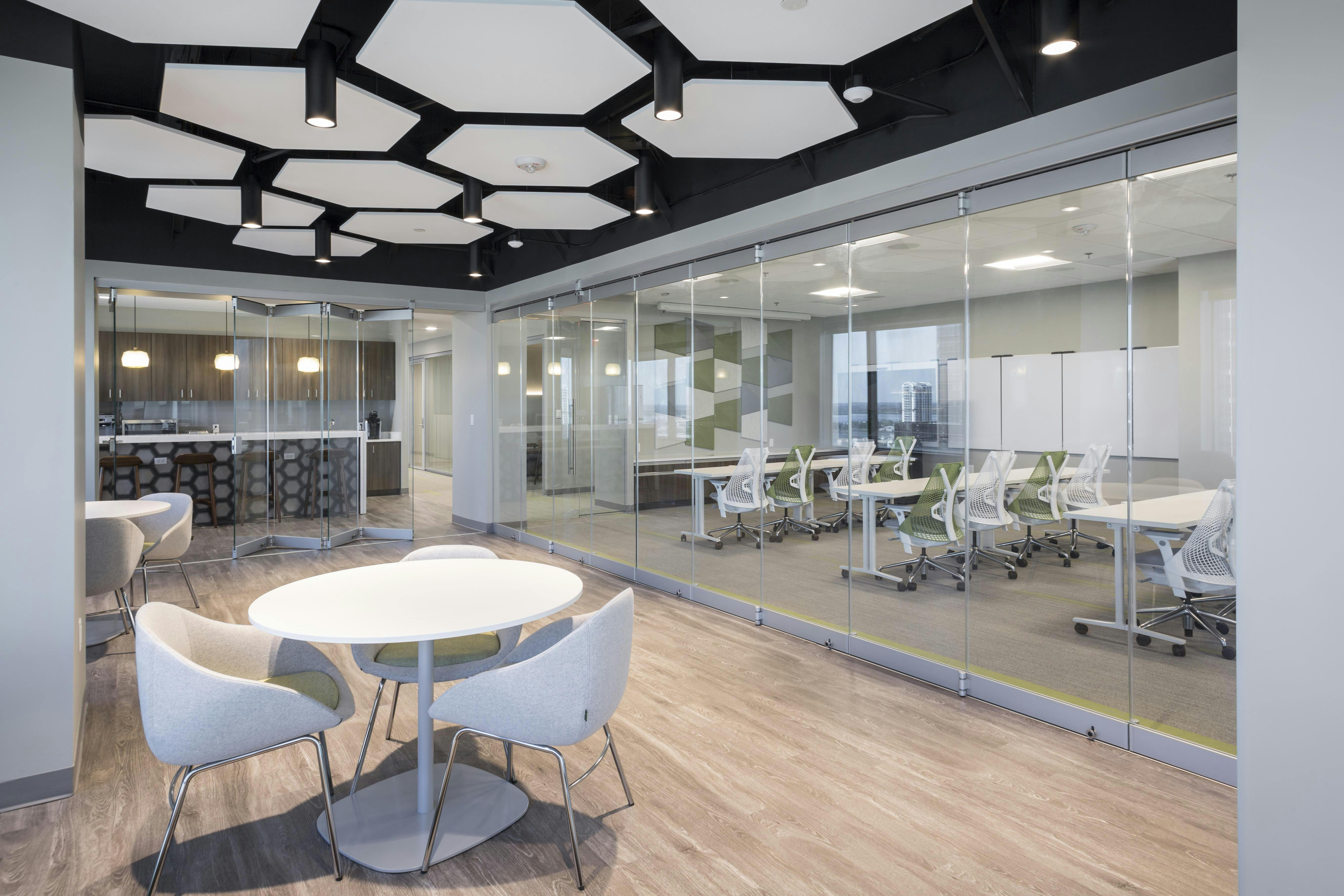 NanaWall Folding glass doors in space-efficient workplace design