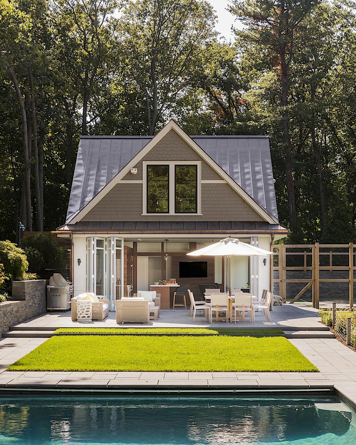 Staycation ultimate pool house with aluminum frame folding glass wall