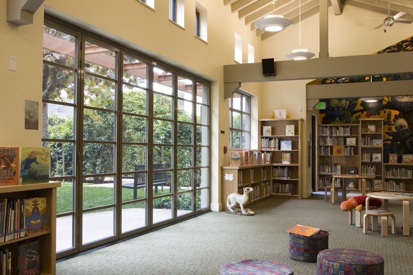 school-library-with-folding-doors-adds-natural-daylight-and-biophilic-design