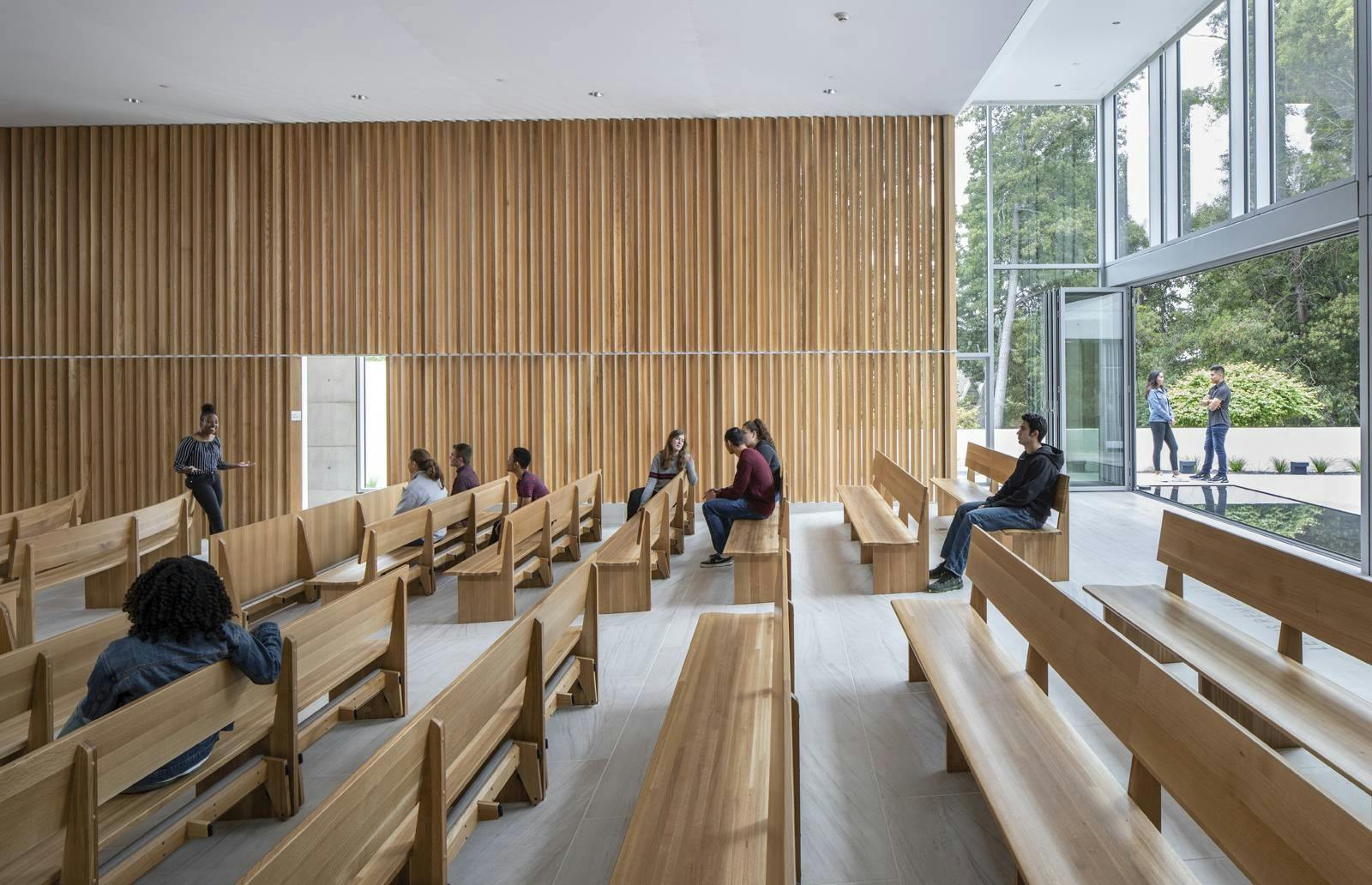 people-sitting-in-church-with-folding-glass-wall