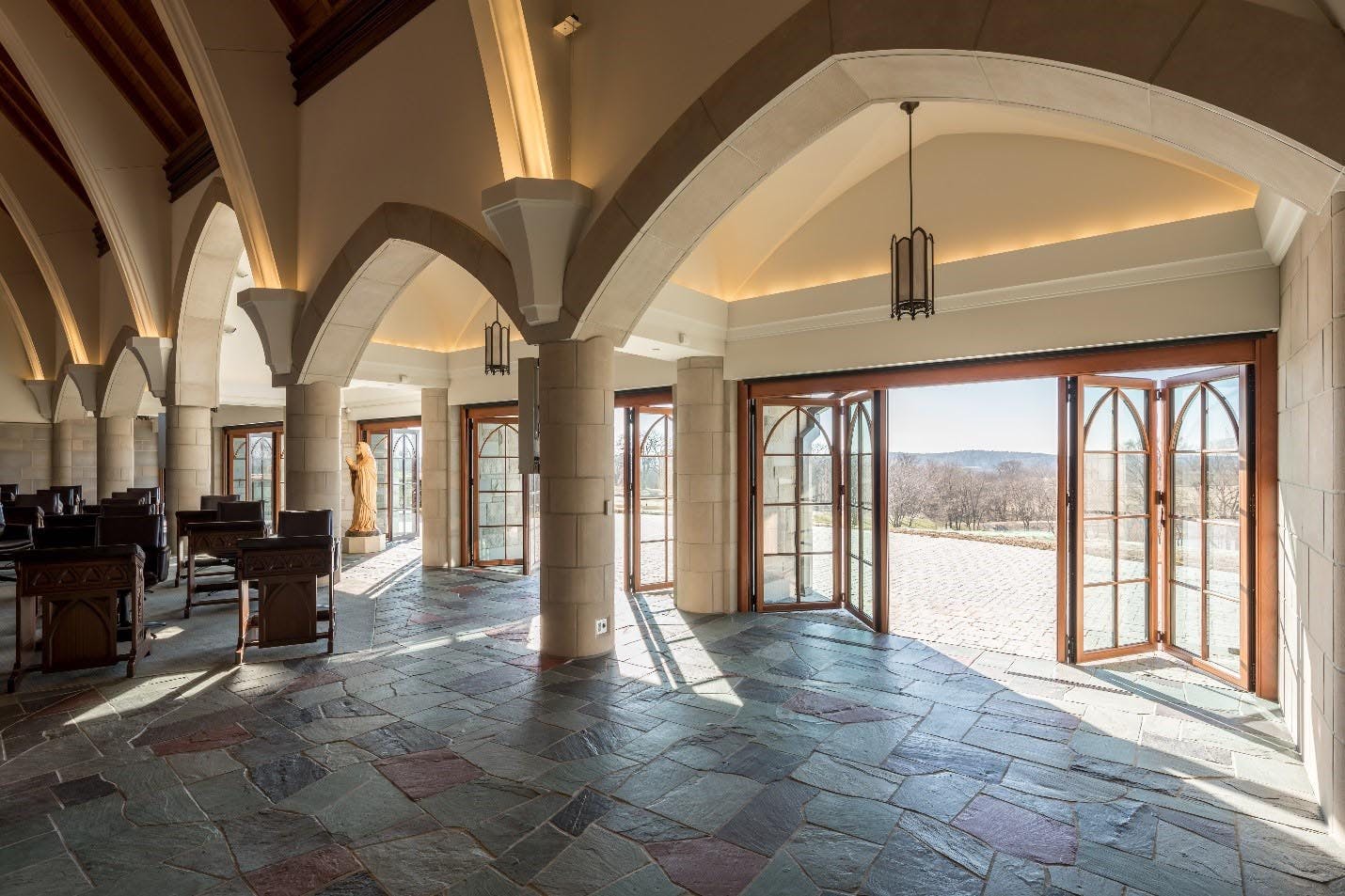 religious institutio interior with blue and white checked floor tiles and wooden foldable walls